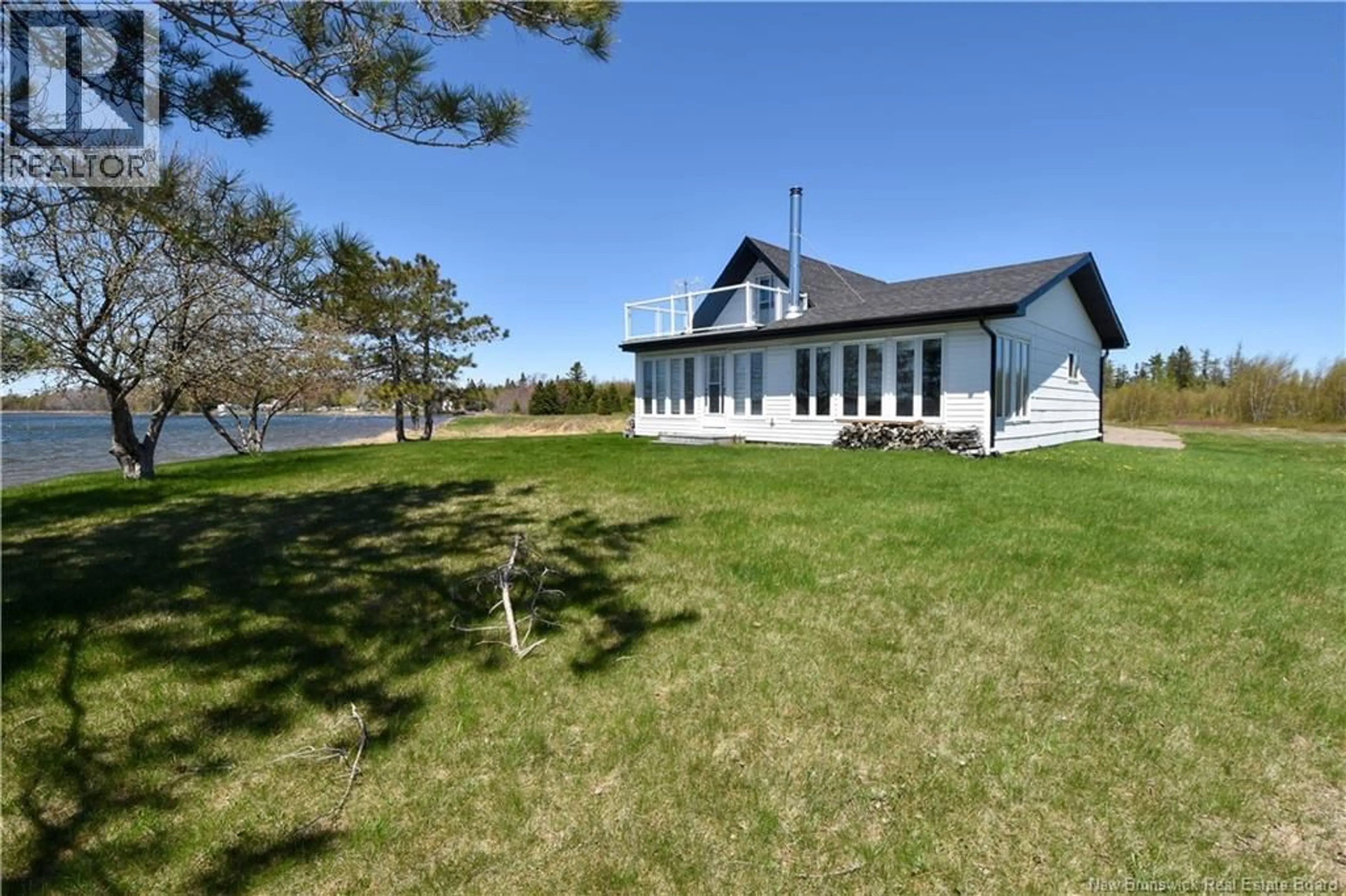 A pic from outside/outdoor area/front of a property/back of a property/a pic from drone, water/lake/river/ocean view for 470 SUREAU BLANC, Tracadie New Brunswick E1X4T9