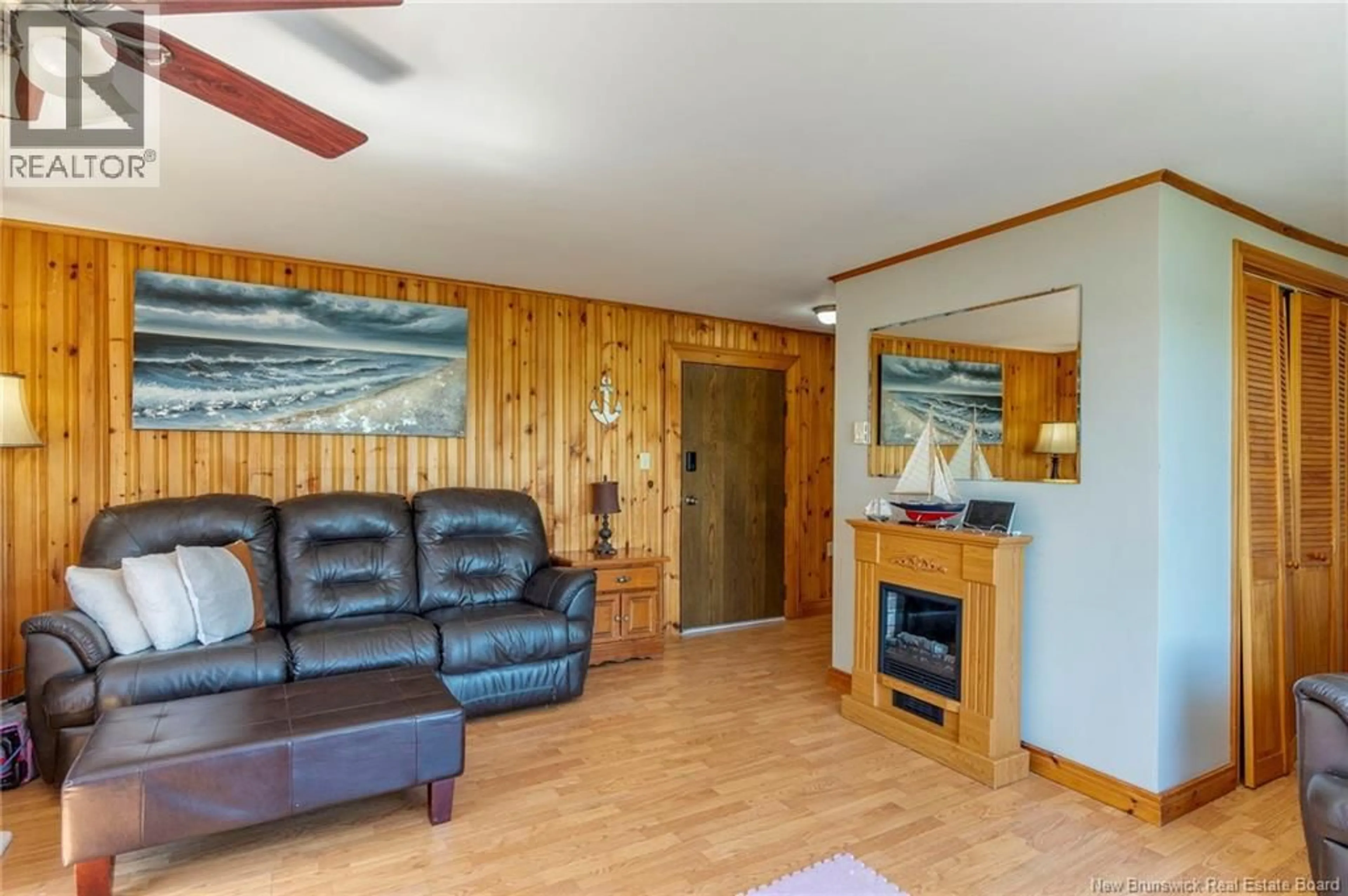 Living room with furniture, wood/laminate floor for 5220 ROUTE 102, Hampstead New Brunswick E5M2B6