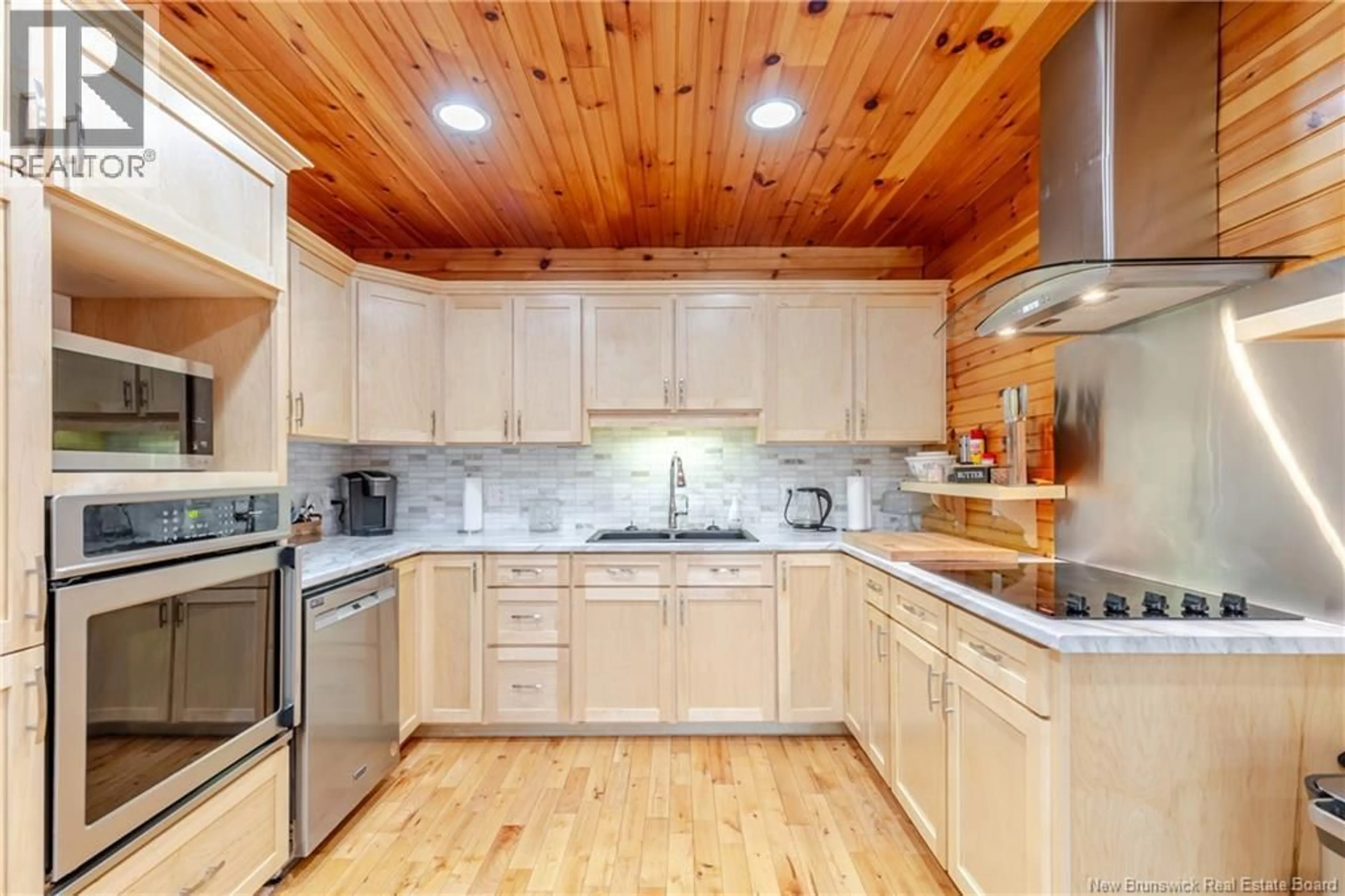 Open concept kitchen, wood/laminate floor for 138 DAVIDSON LAKE ROAD, Dumfries New Brunswick E6G1S4