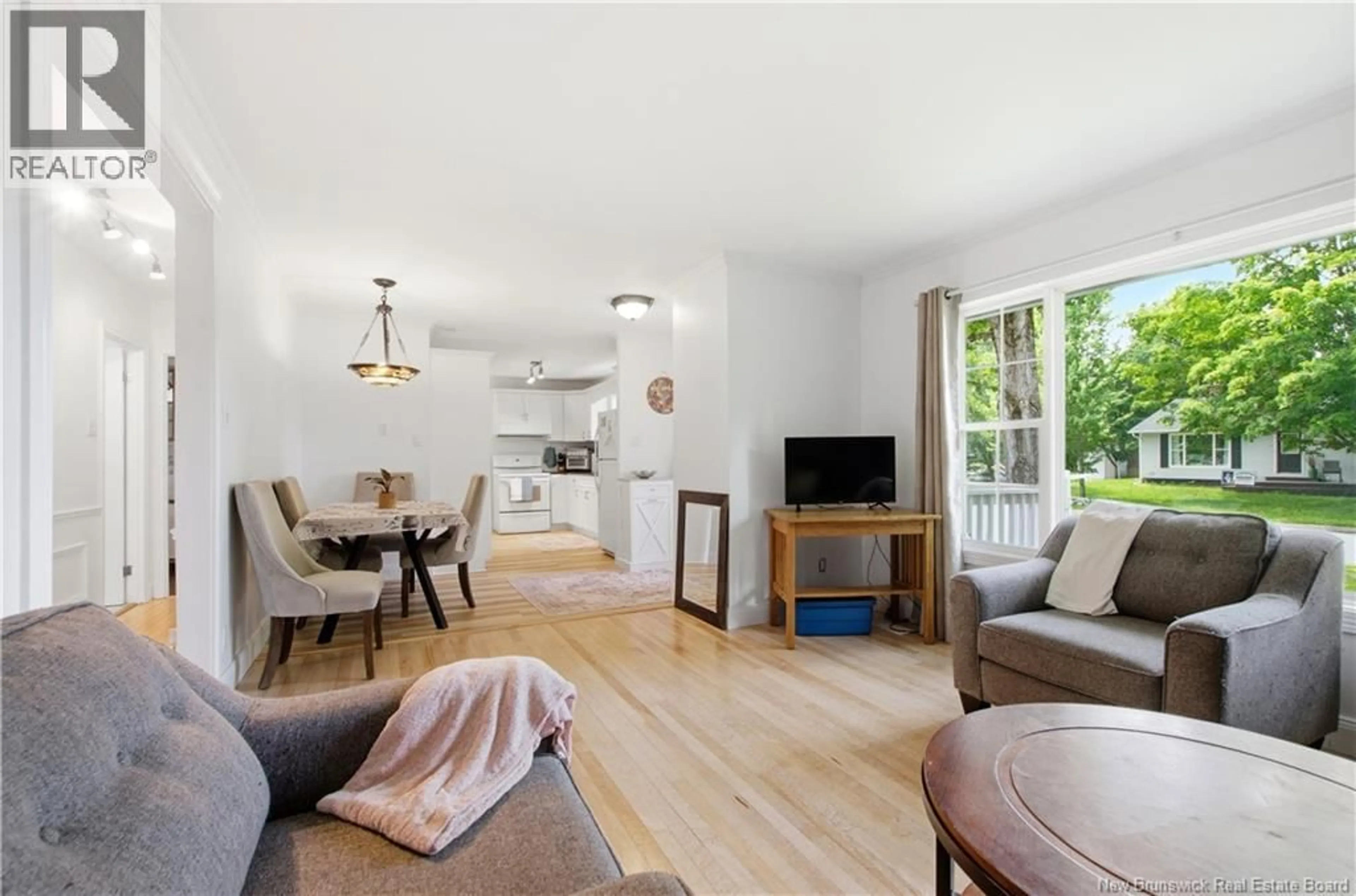 Living room with furniture, wood/laminate floor for 114 EDGEWOOD DRIVE, Fredericton New Brunswick E3A1T1