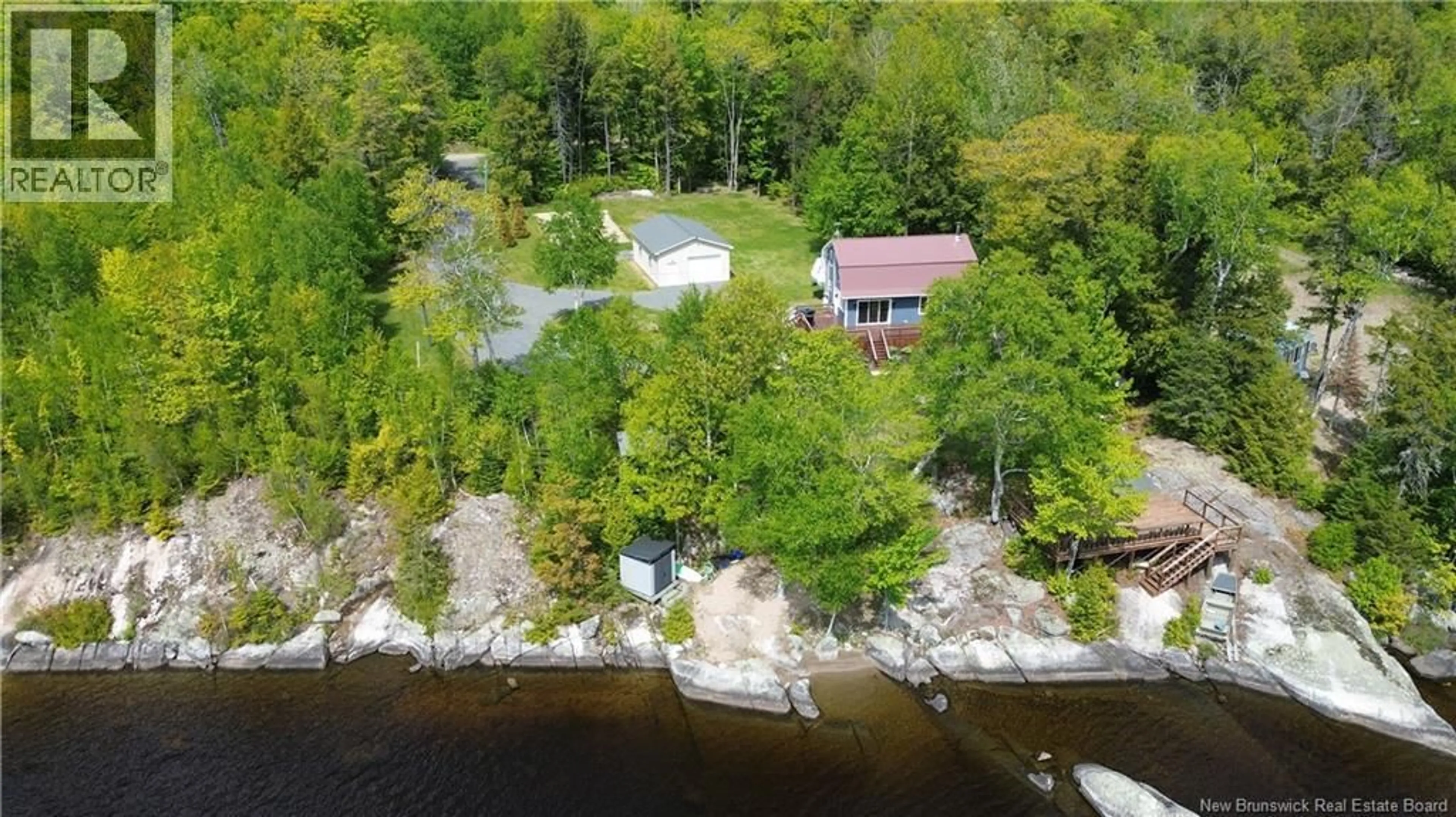 A pic from outside/outdoor area/front of a property/back of a property/a pic from drone, water/lake/river/ocean view for 229 SECOND EEL RIVER LANE, Eel River Lake New Brunswick E6H0B5