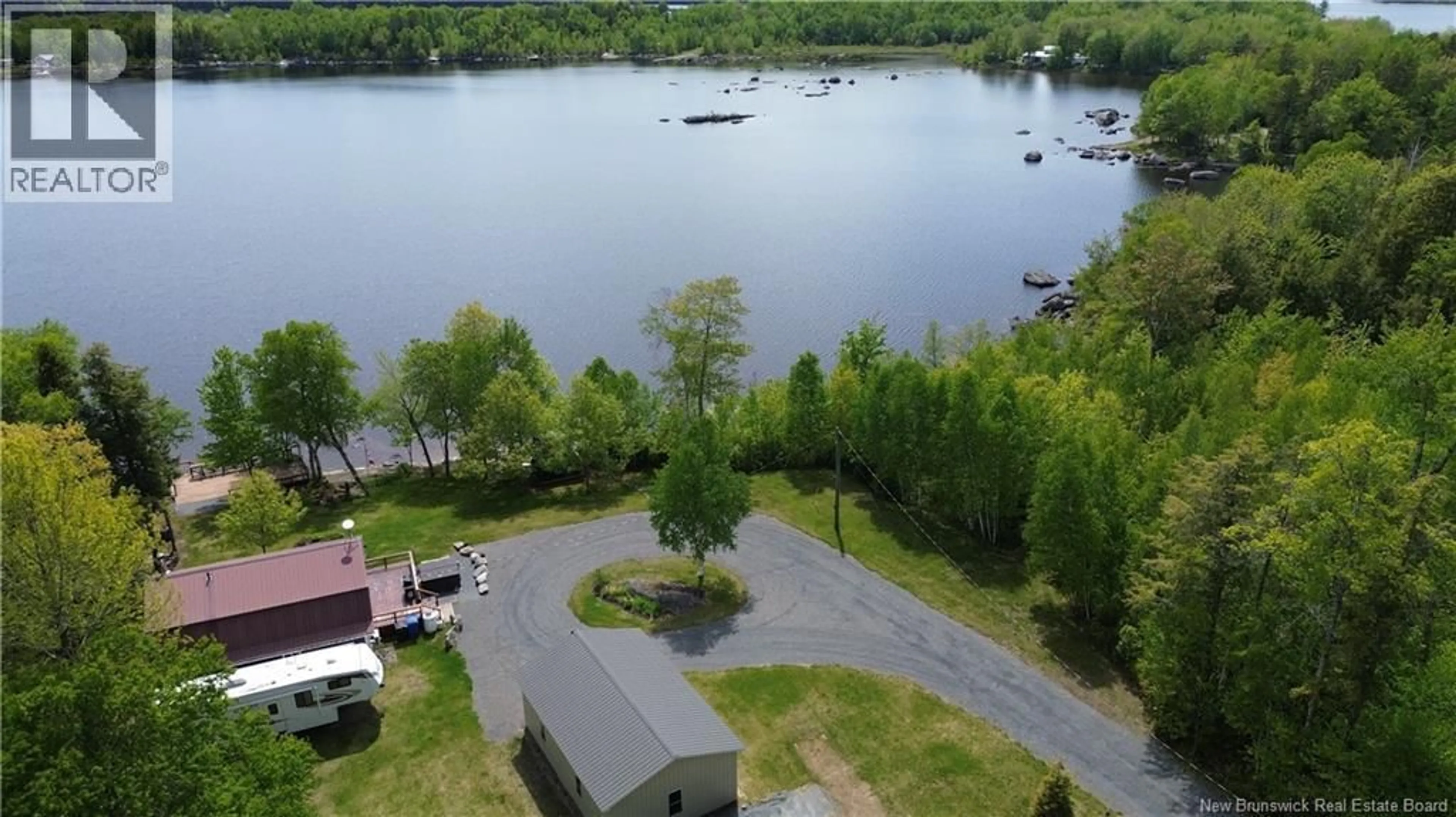 A pic from outside/outdoor area/front of a property/back of a property/a pic from drone, water/lake/river/ocean view for 229 SECOND EEL RIVER LANE, Eel River Lake New Brunswick E6H0B5