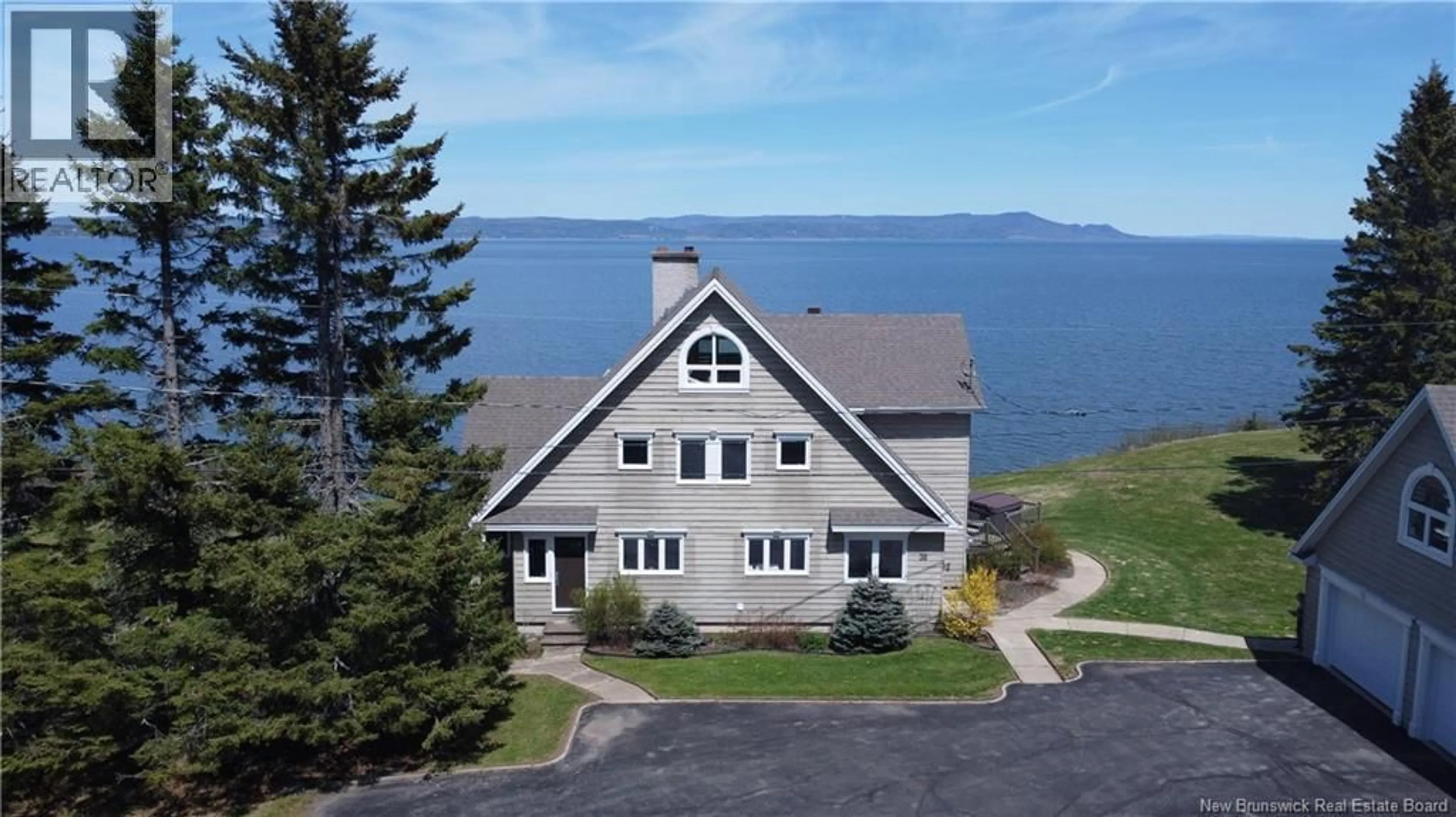 A pic from outside/outdoor area/front of a property/back of a property/a pic from drone, water/lake/river/ocean view for 30 REID ROAD, Charlo New Brunswick E8E2R2
