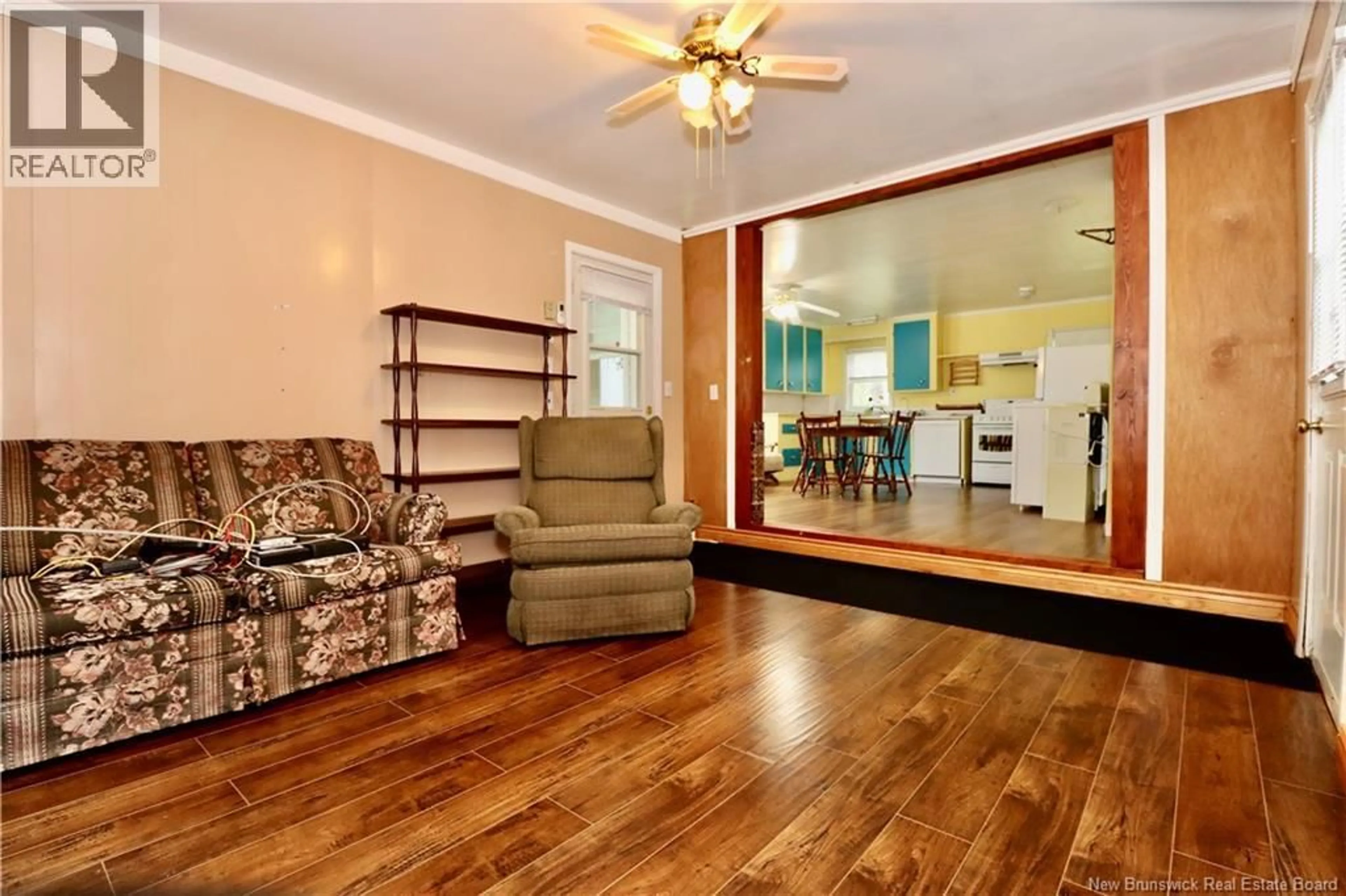 Living room with furniture, wood/laminate floor for 12 GODDARD, Wheaton Settlement New Brunswick E4Z3S8