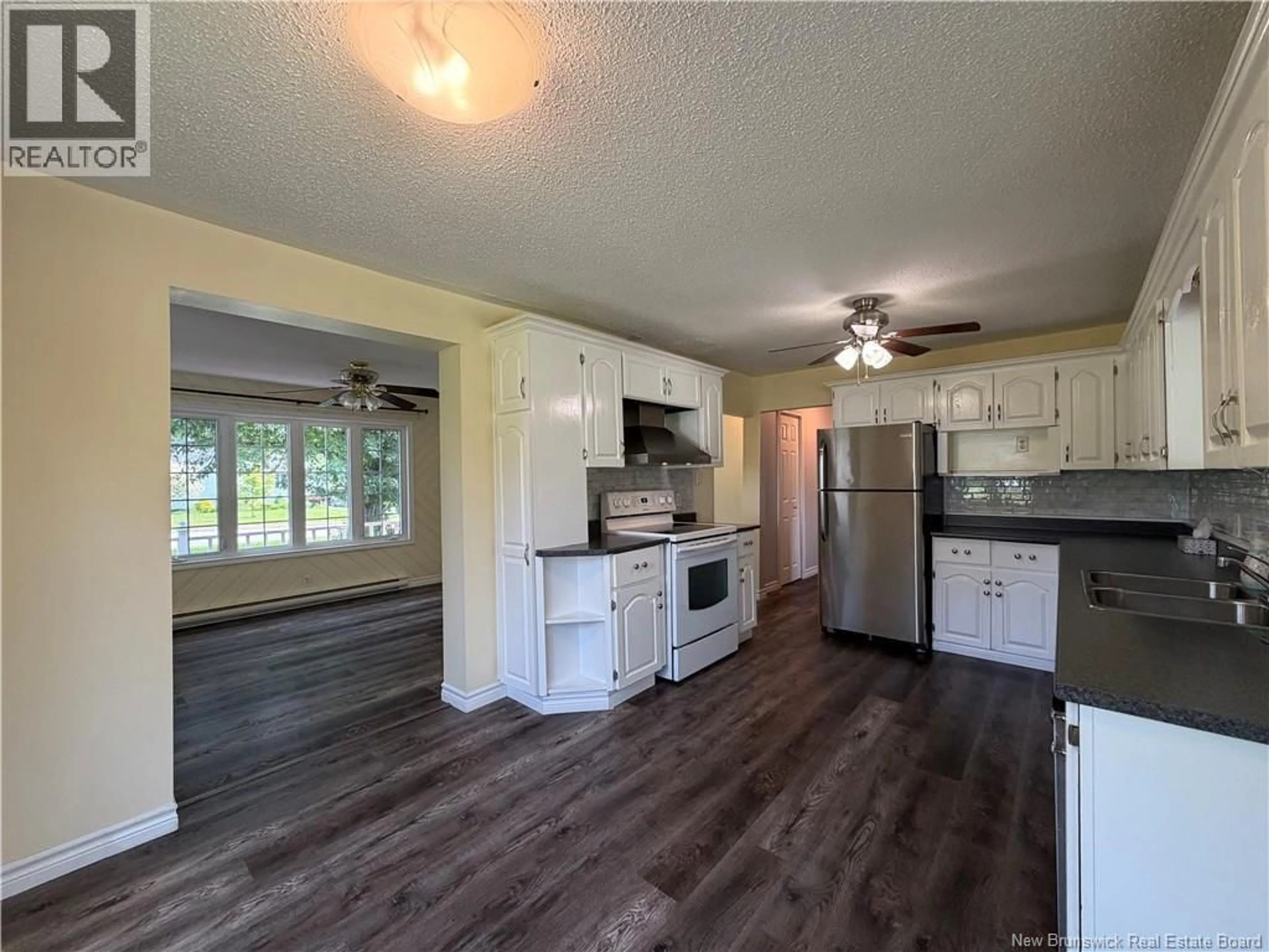 Open concept kitchen, wood/laminate floor for 289 PERCY KELLY DRIVE, Miramichi New Brunswick E1V5V5