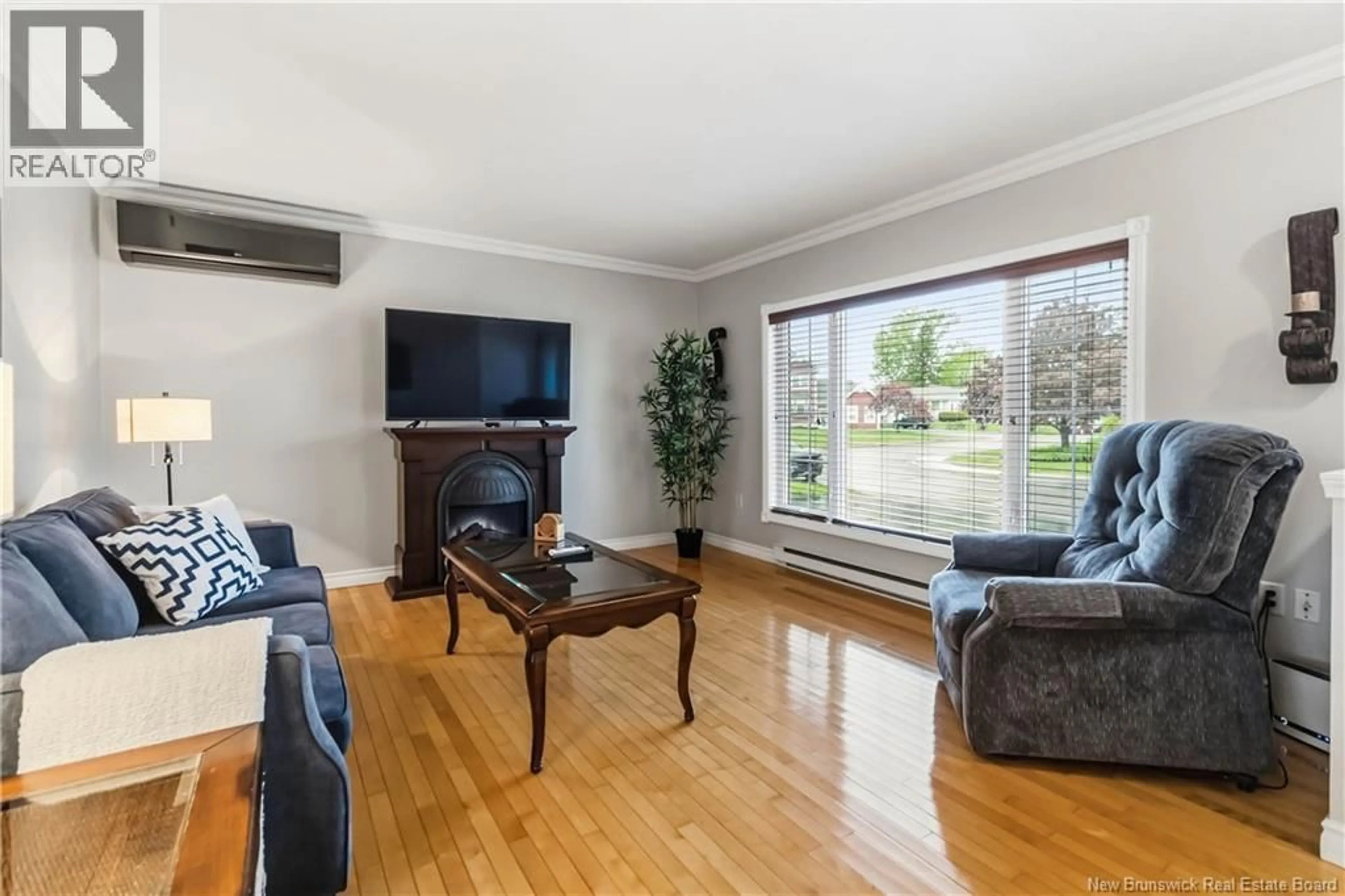Living room with furniture, wood/laminate floor for 99 FAIRVIEW KNOLL DRIVE, Moncton New Brunswick E1A6L2