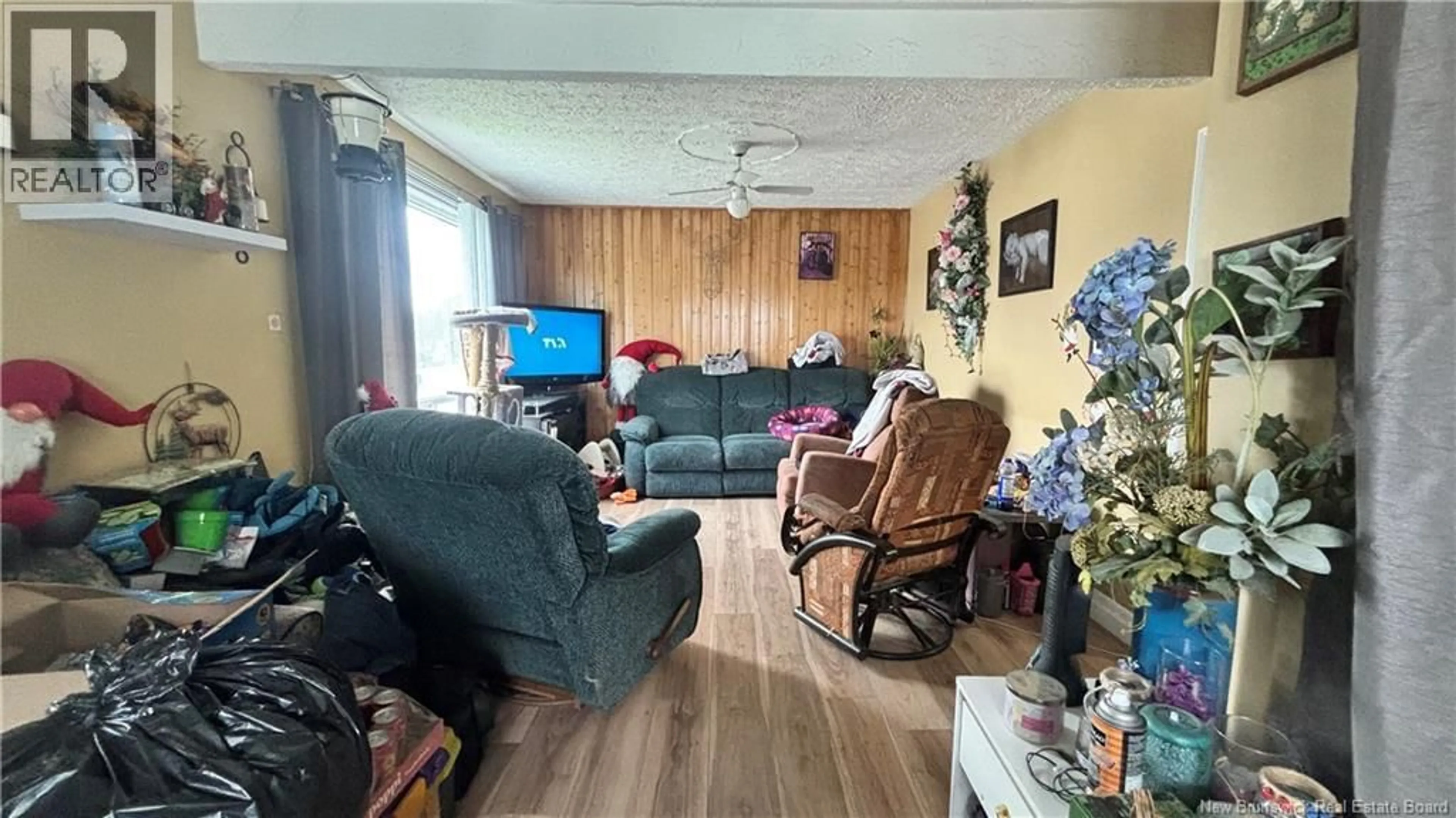 Living room with furniture, wood/laminate floor for 17 DAIGLE STREET, Edmundston New Brunswick E3V1G4