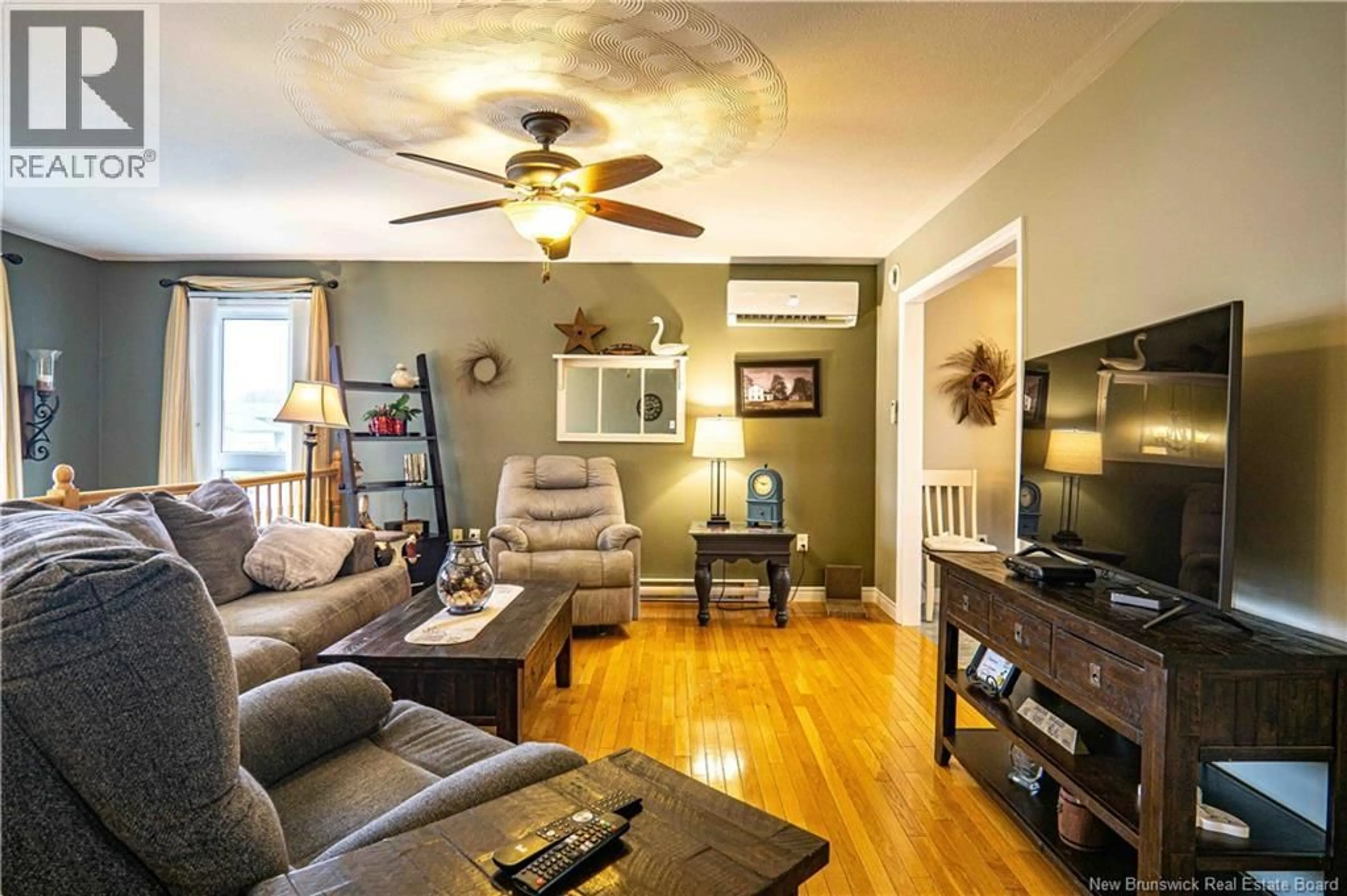 Living room with furniture, wood/laminate floor for 47 RIPLEY STREET, Oromocto New Brunswick E2V4P9