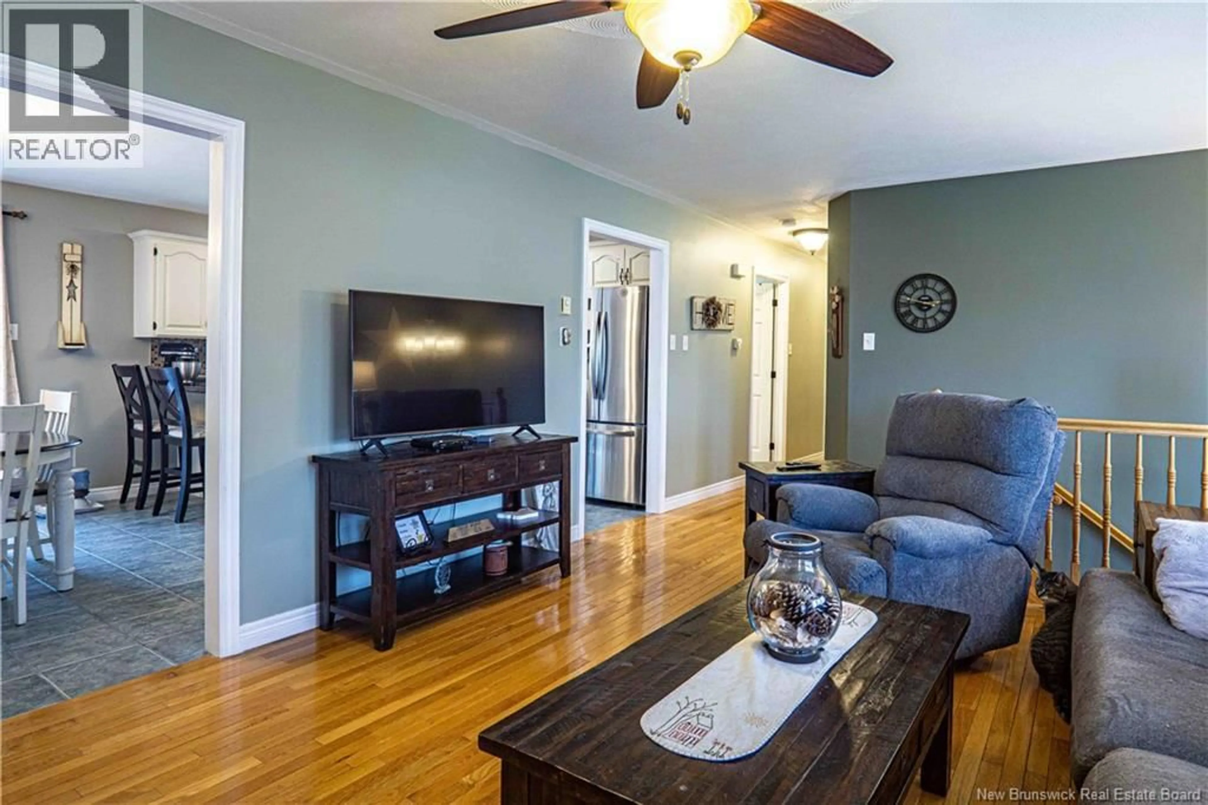 Living room with furniture, wood/laminate floor for 47 RIPLEY STREET, Oromocto New Brunswick E2V4P9