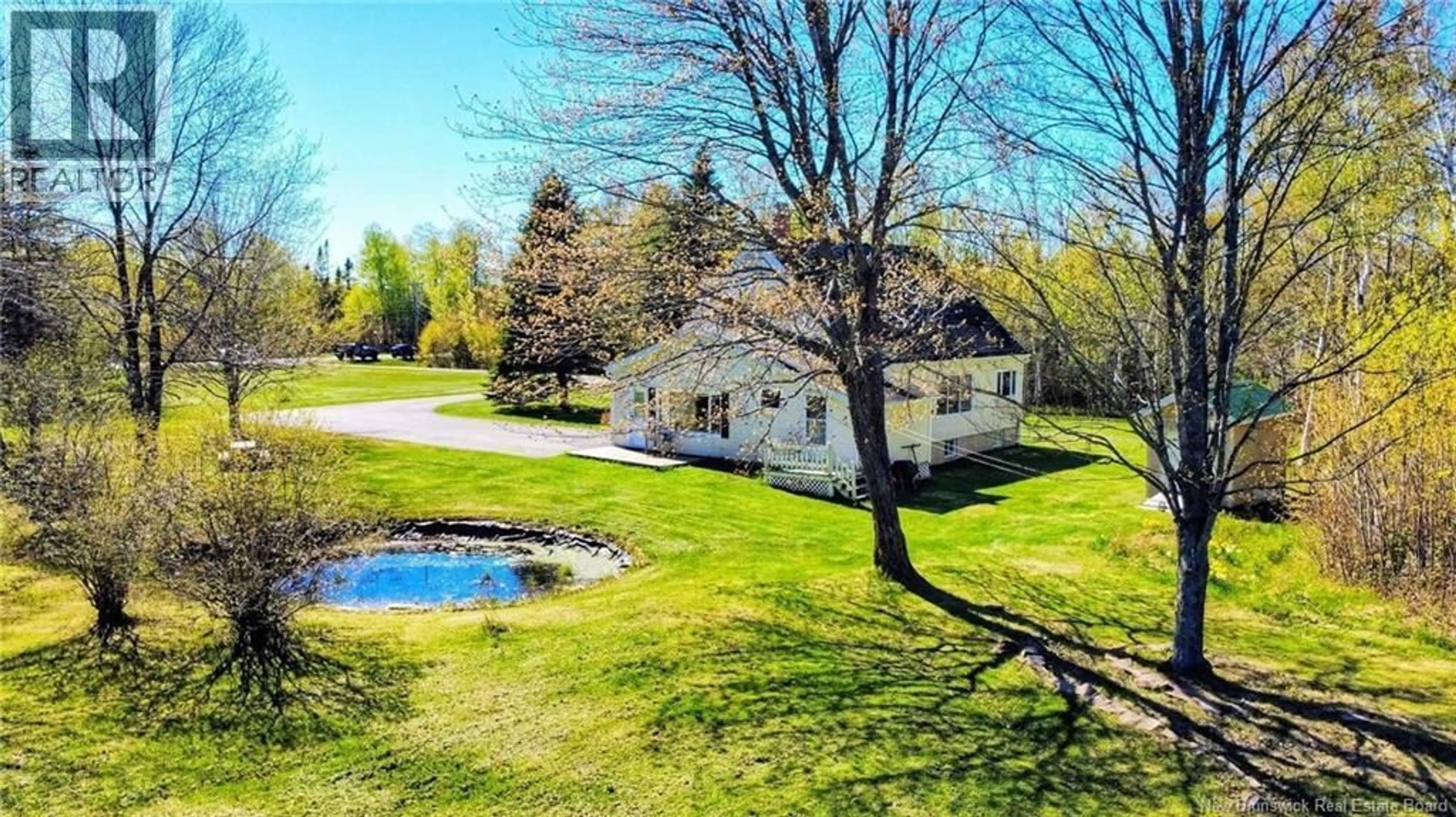 A pic from outside/outdoor area/front of a property/back of a property/a pic from drone, water/lake/river/ocean view for 22 RUE DU PONT STREET, Bertrand New Brunswick E1W1J2