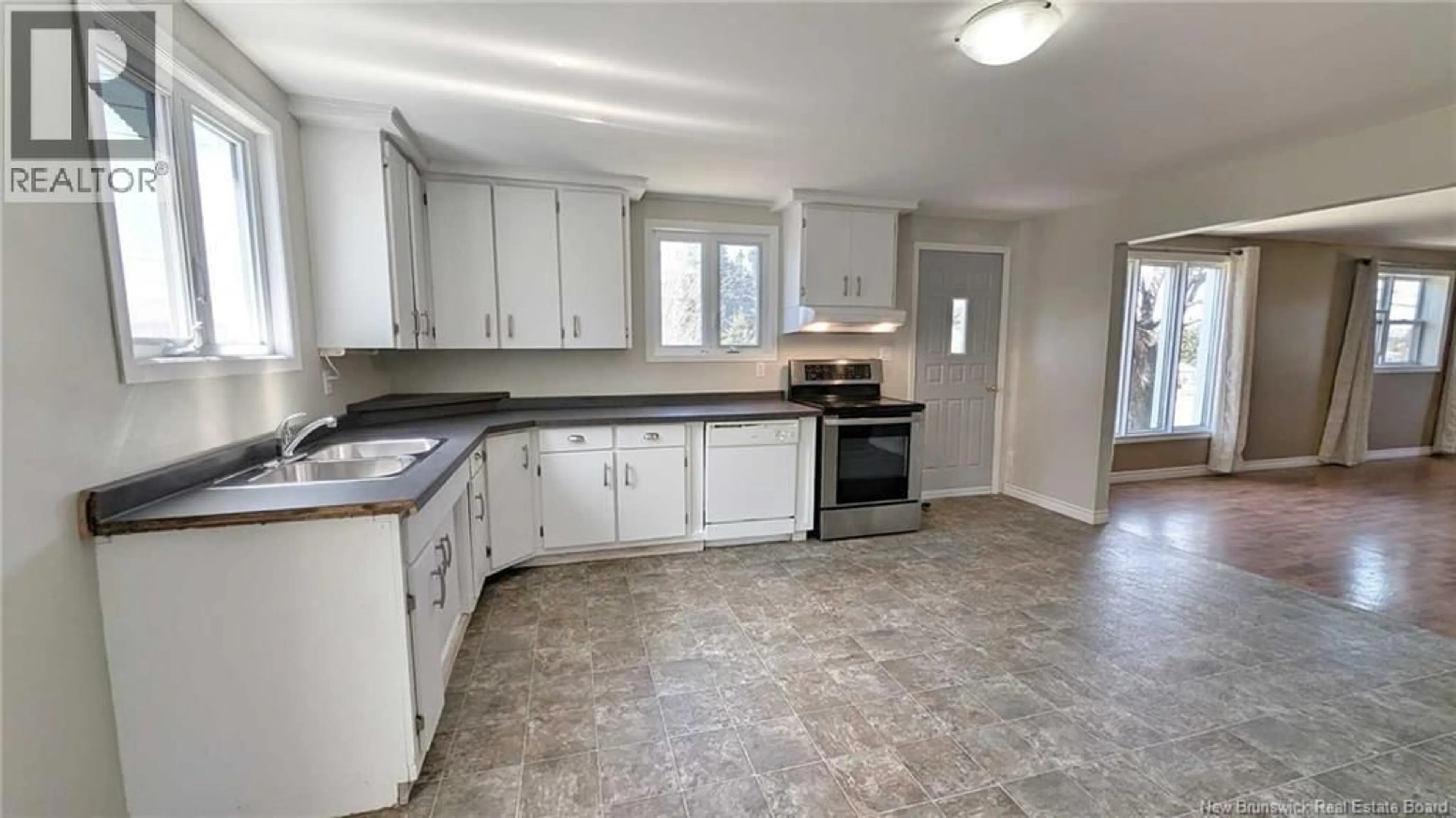 Open concept kitchen, ceramic/tile floor for 25 RUE DU PORTAGE, Caraquet New Brunswick E1W1A8
