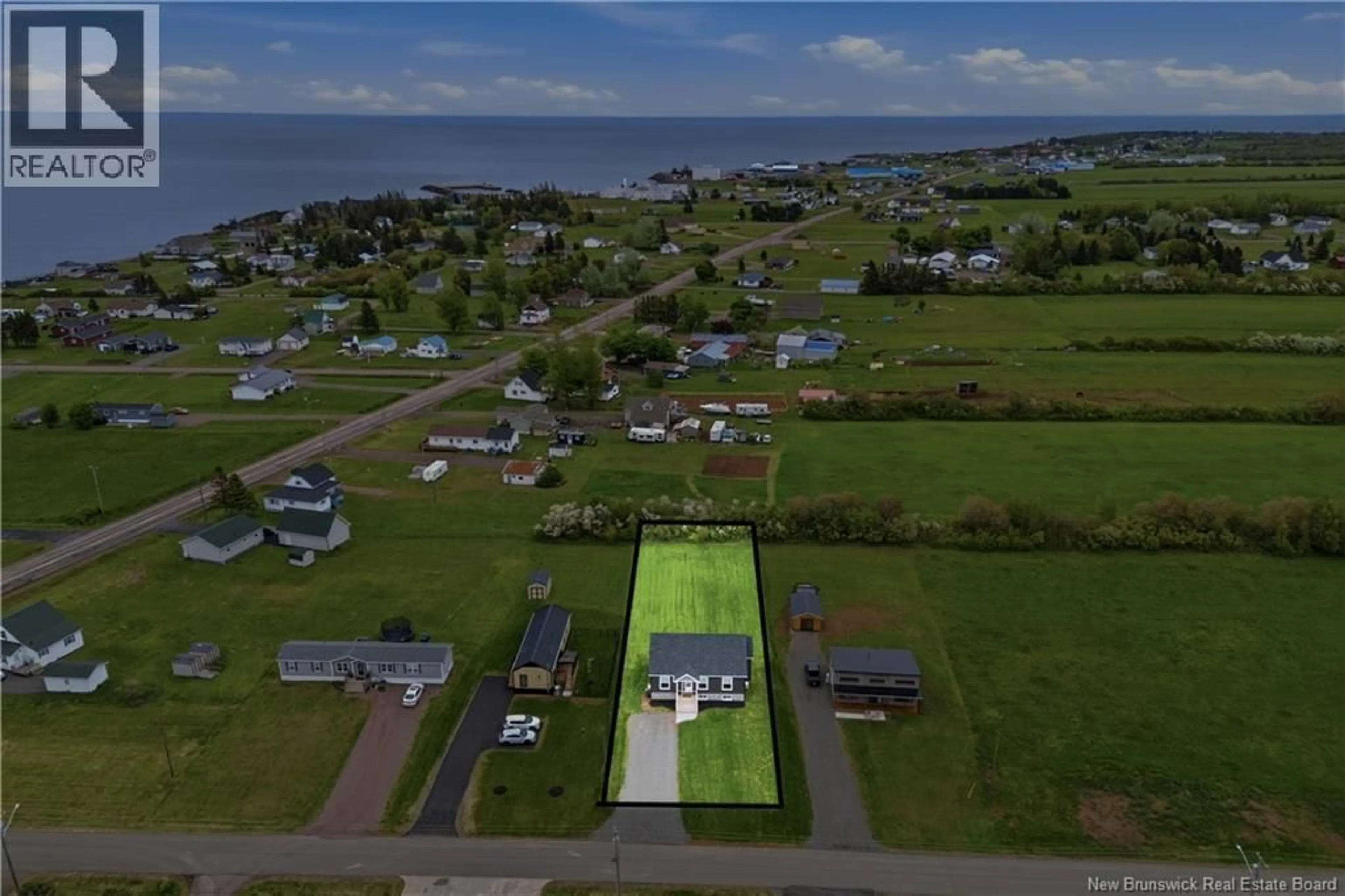 A pic from outside/outdoor area/front of a property/back of a property/a pic from drone, water/lake/river/ocean view for 18 BEDECHE STREET, Cap-Pelé New Brunswick E4N0G1
