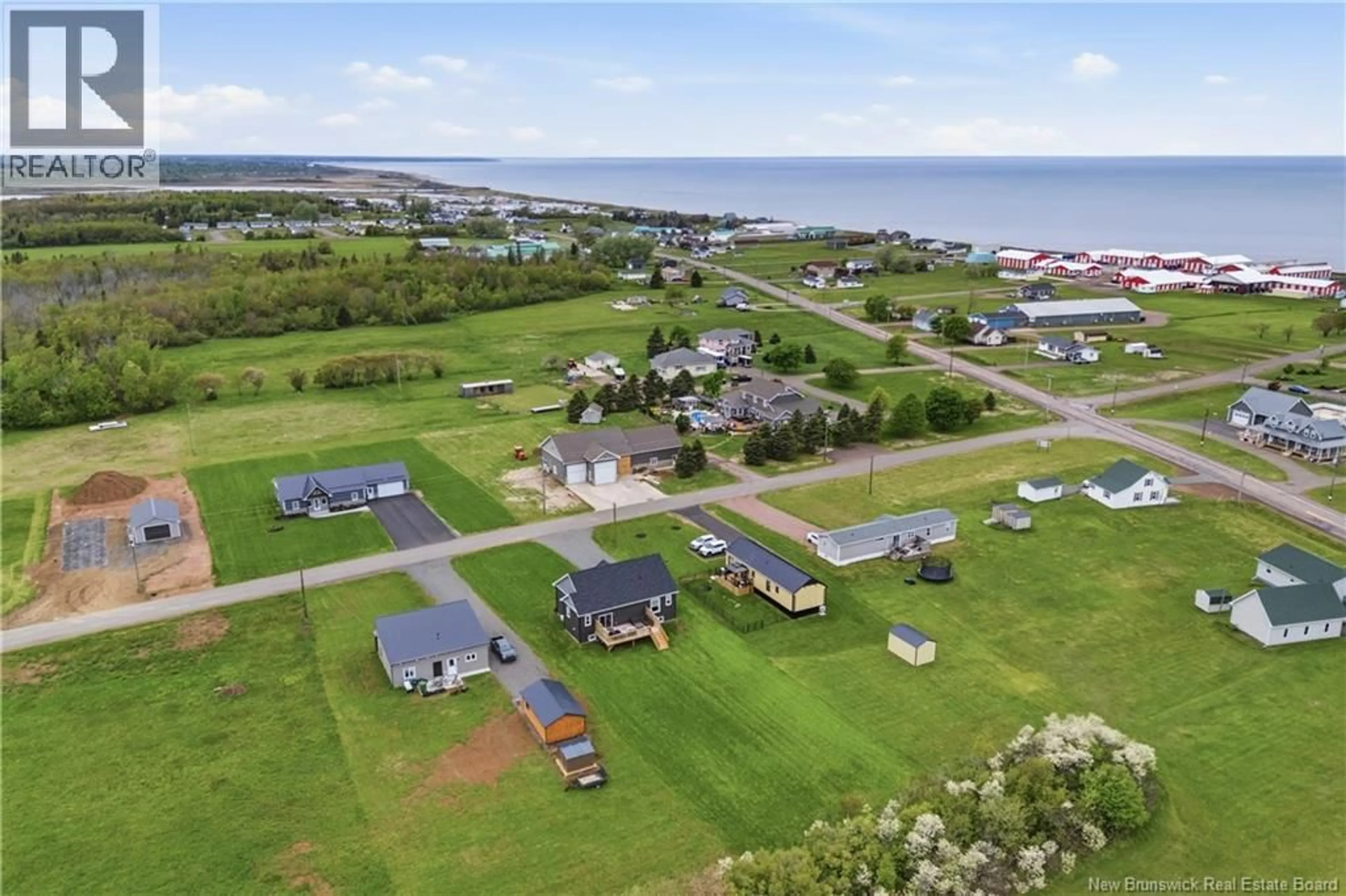 A pic from outside/outdoor area/front of a property/back of a property/a pic from drone, water/lake/river/ocean view for 18 BEDECHE STREET, Cap-Pelé New Brunswick E4N0G1