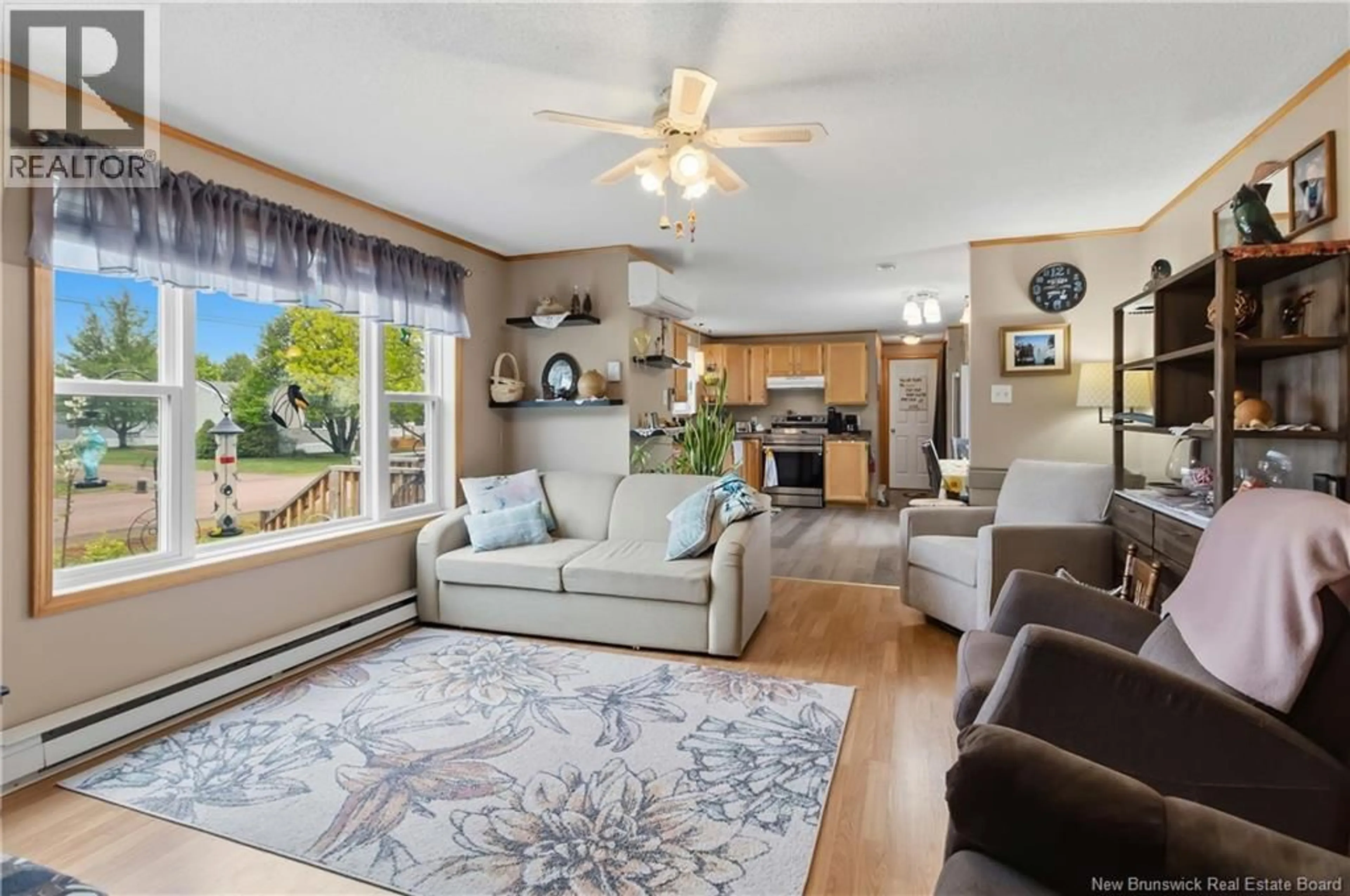 Living room with furniture, wood/laminate floor for 10 PERIDOT STREET, Moncton New Brunswick E1H3E5