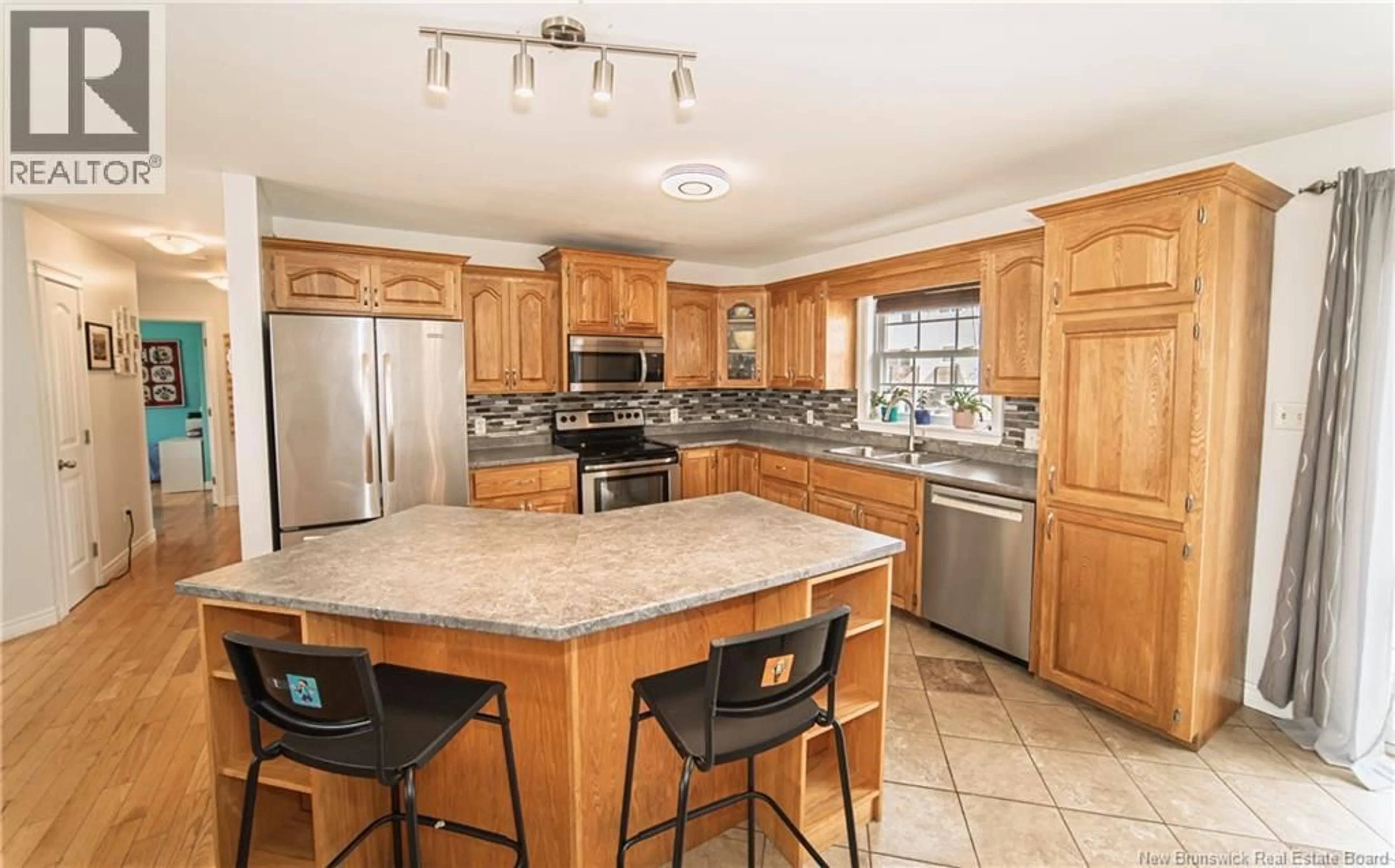 Open concept kitchen, ceramic/tile floor for 66 WATLING CRESCENT, Oromocto New Brunswick E2V4M8