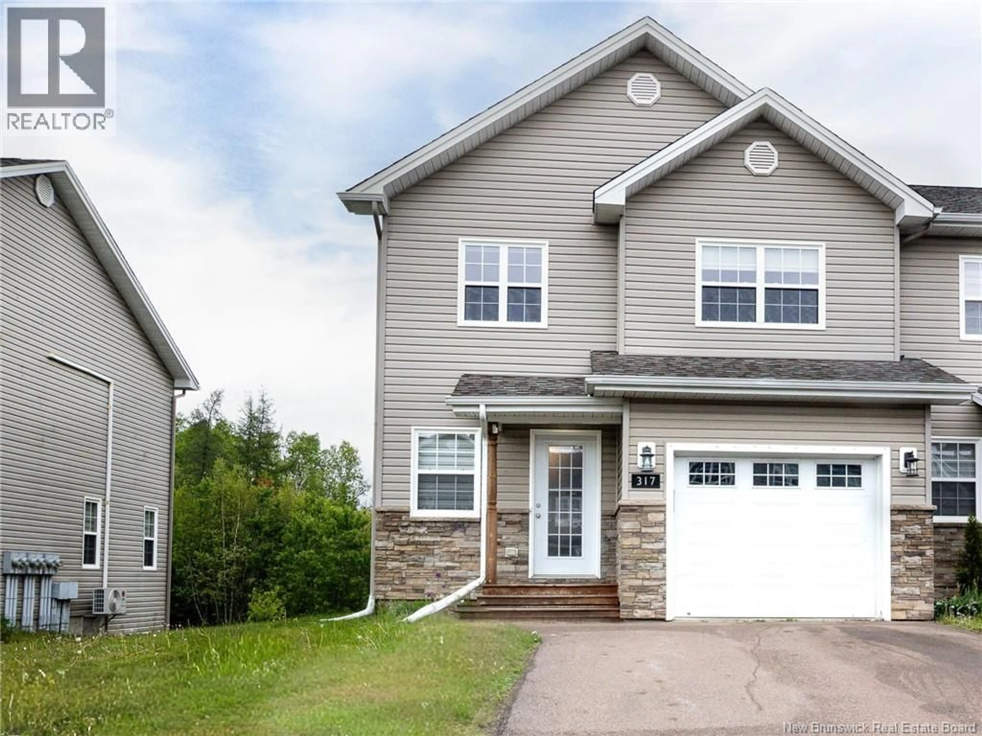 Home with vinyl exterior material, street for 317 DOLBEAU, Dieppe New Brunswick E1A9P9