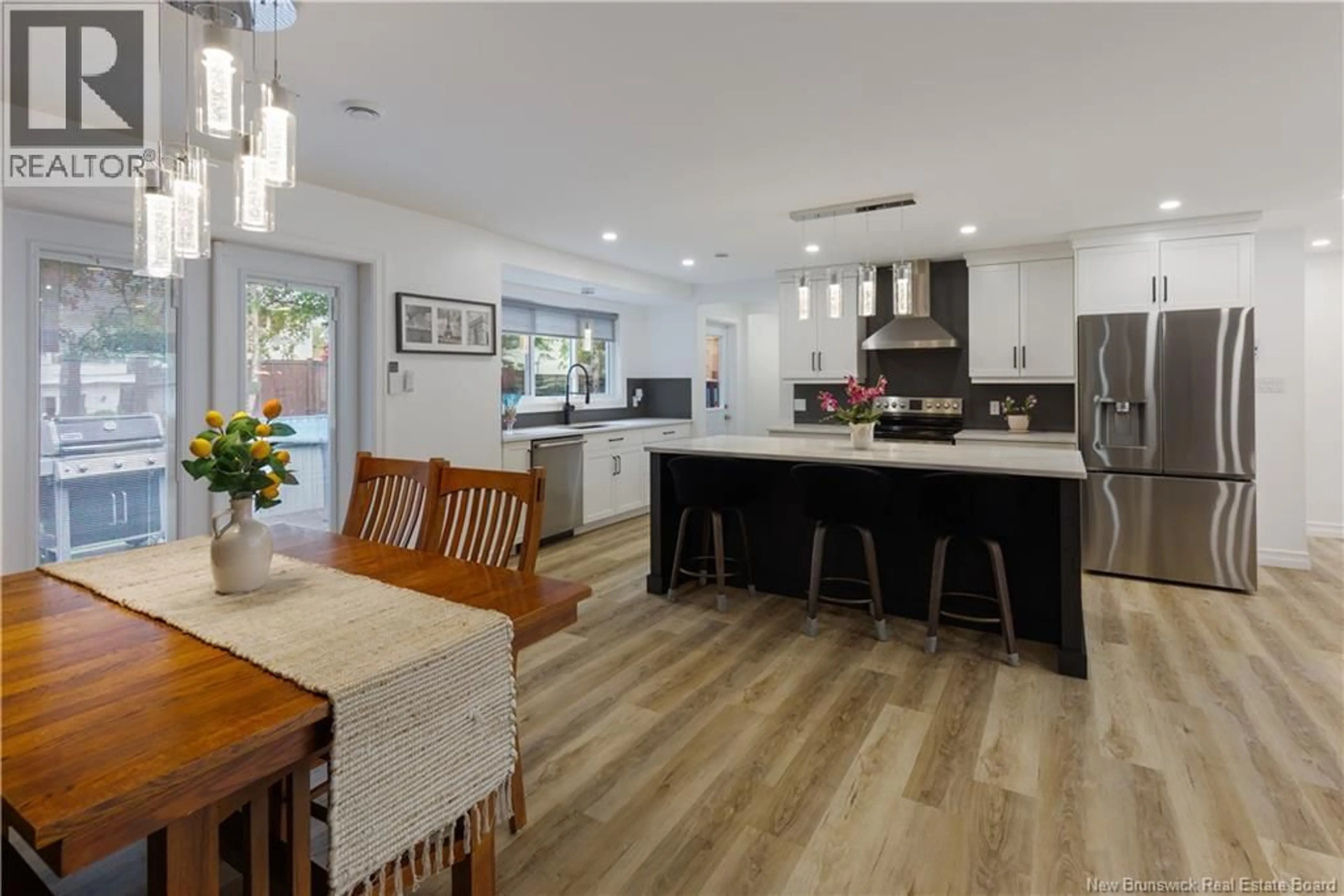 Open concept kitchen, wood/laminate floor for 26 ALEXANDER AVENUE, Moncton New Brunswick E1E1T2