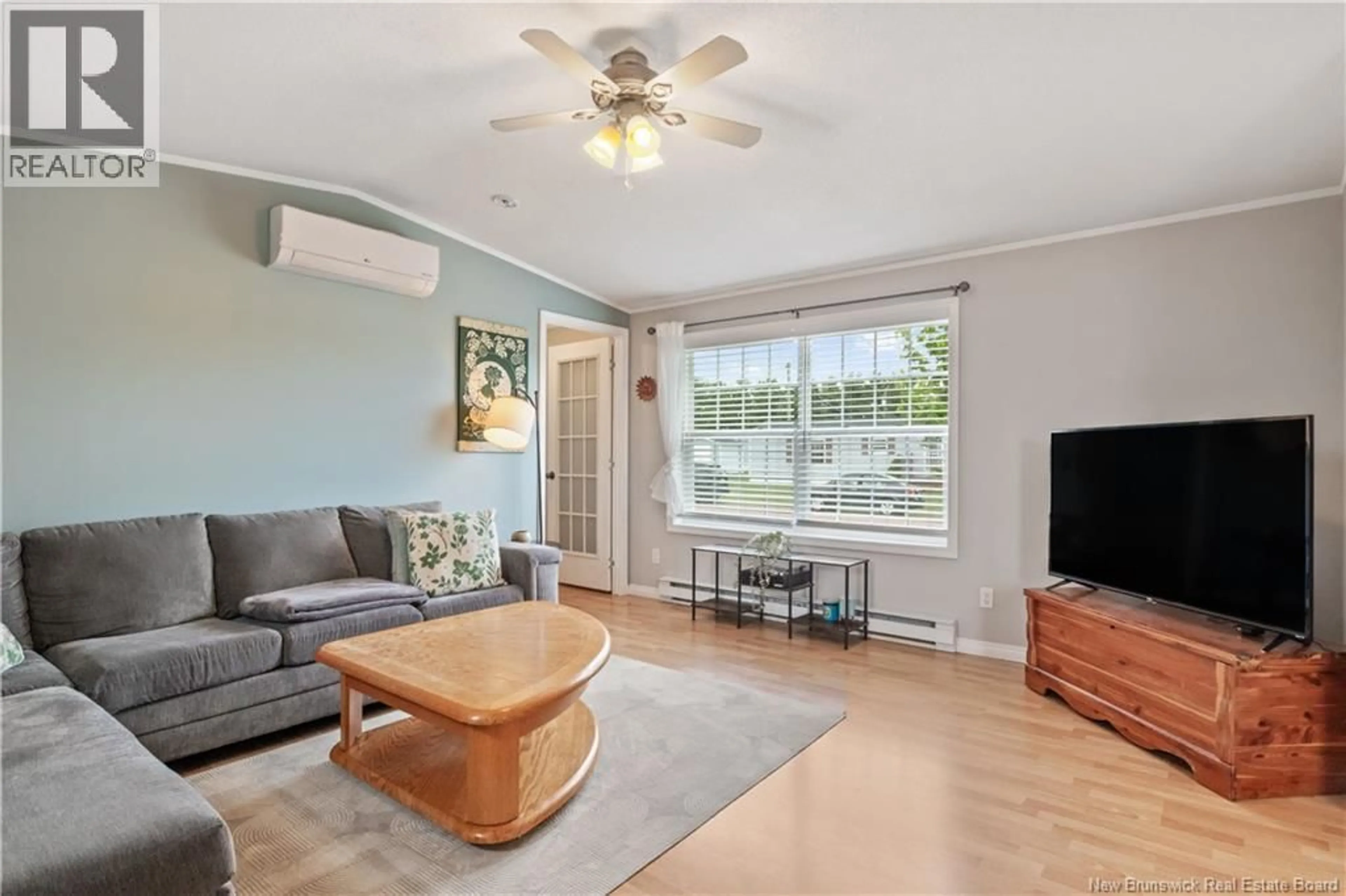 Living room with furniture, wood/laminate floor for 11 BLUE ASH, Moncton New Brunswick E1H3R1