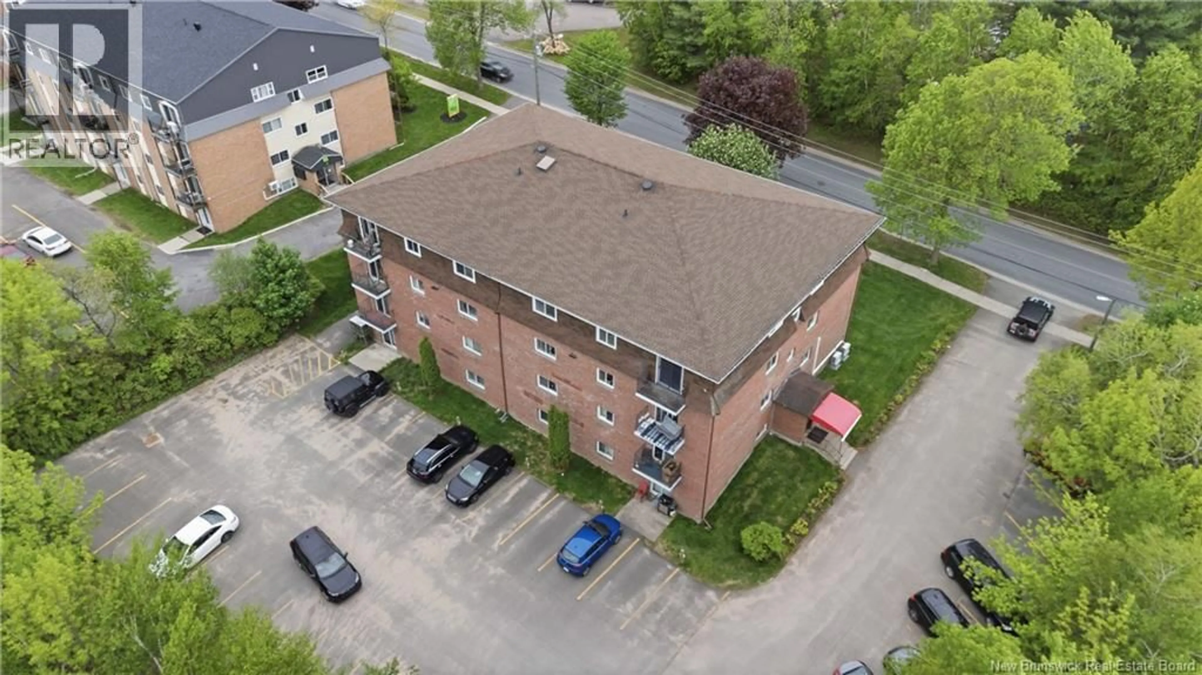 A pic from outside/outdoor area/front of a property/back of a property/a pic from drone, building for 4 - 109 BIGGS STREET, Fredericton New Brunswick E3B6H8