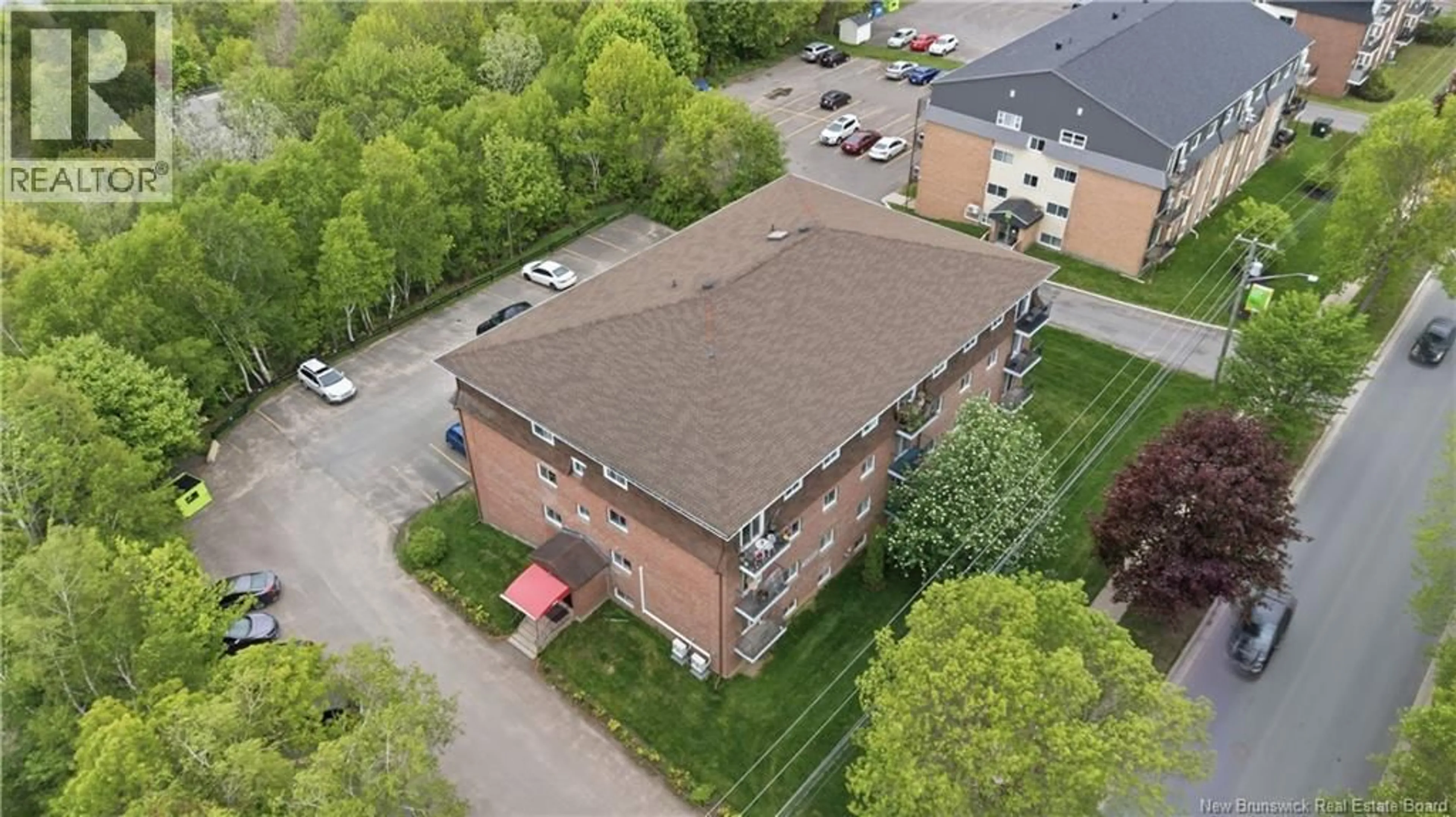 A pic from outside/outdoor area/front of a property/back of a property/a pic from drone, building for 4 - 109 BIGGS STREET, Fredericton New Brunswick E3B6H8