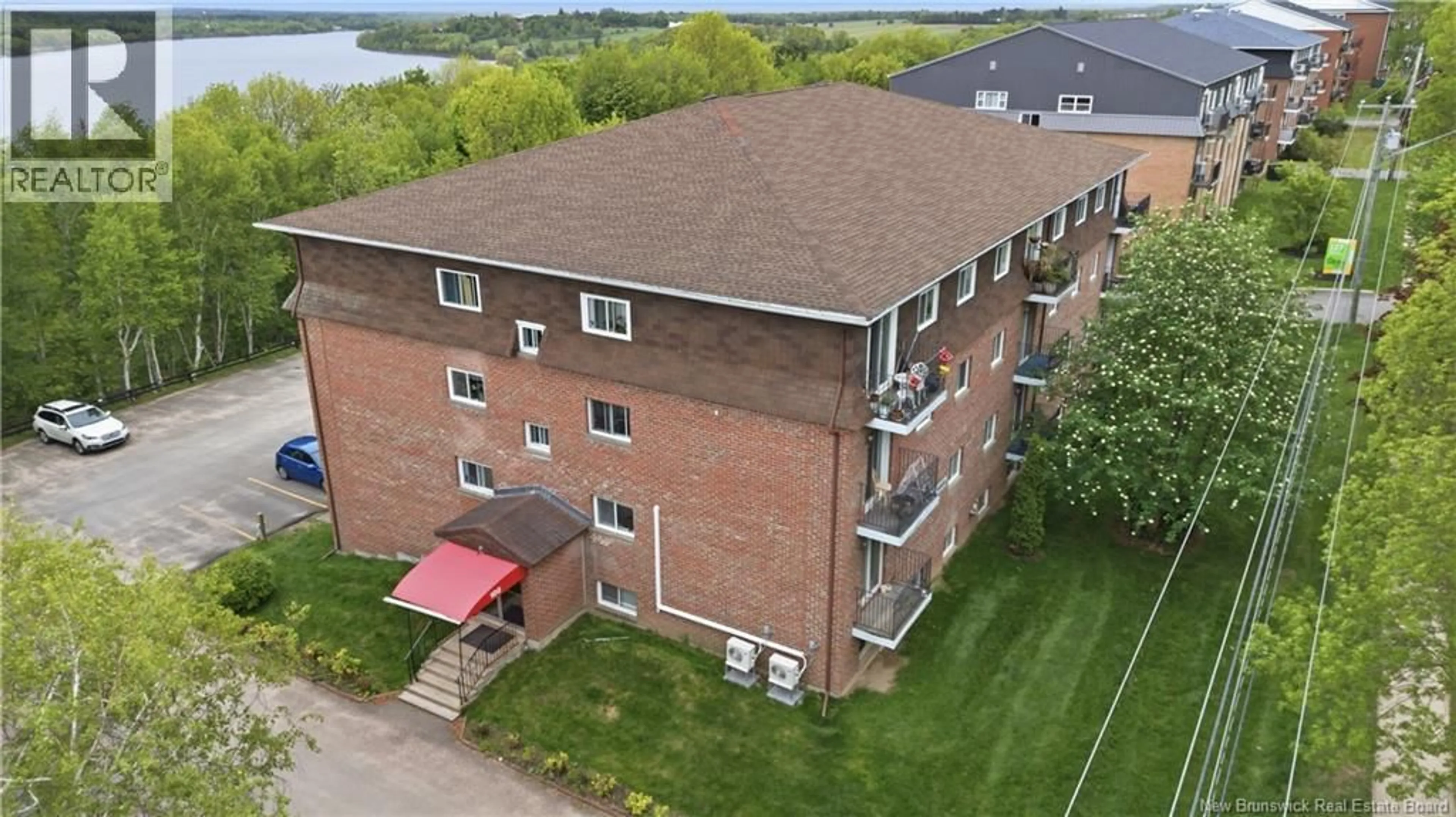 A pic from outside/outdoor area/front of a property/back of a property/a pic from drone, building for 4 - 109 BIGGS STREET, Fredericton New Brunswick E3B6H8