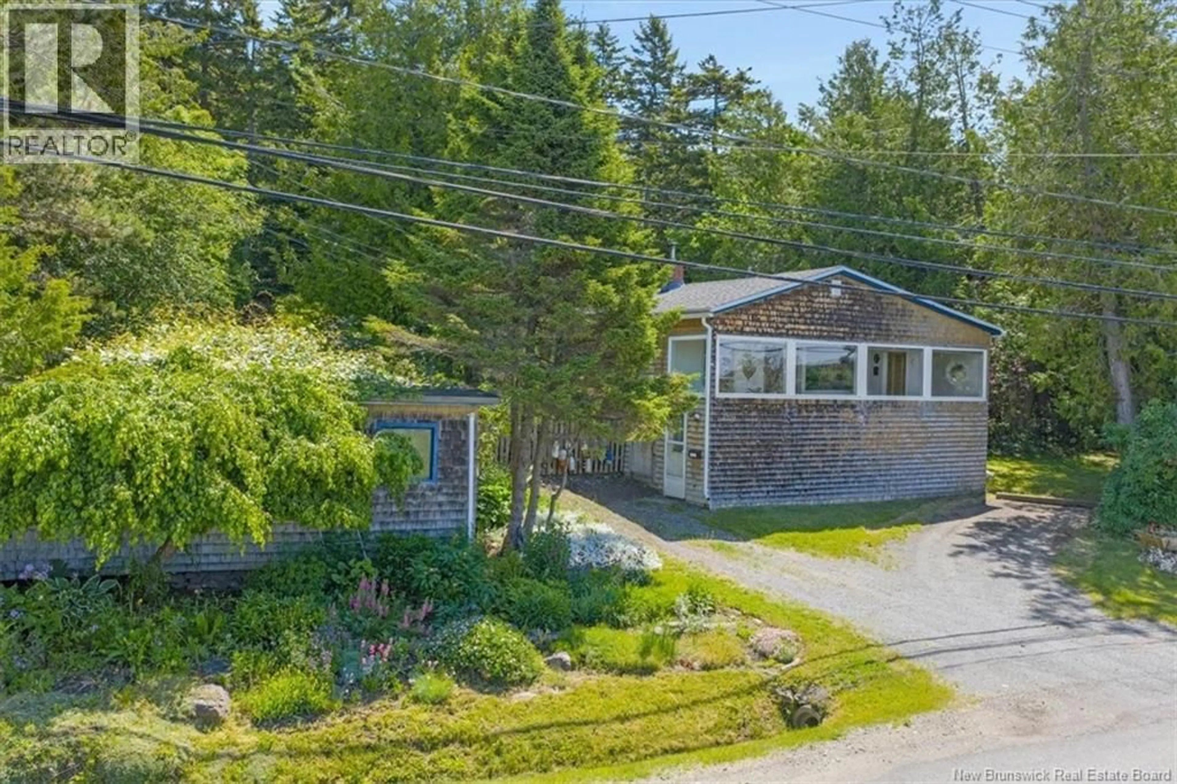 A pic from outside/outdoor area/front of a property/back of a property/a pic from drone, street for 1721 RED HEAD ROAD, Saint John New Brunswick E2P1K5
