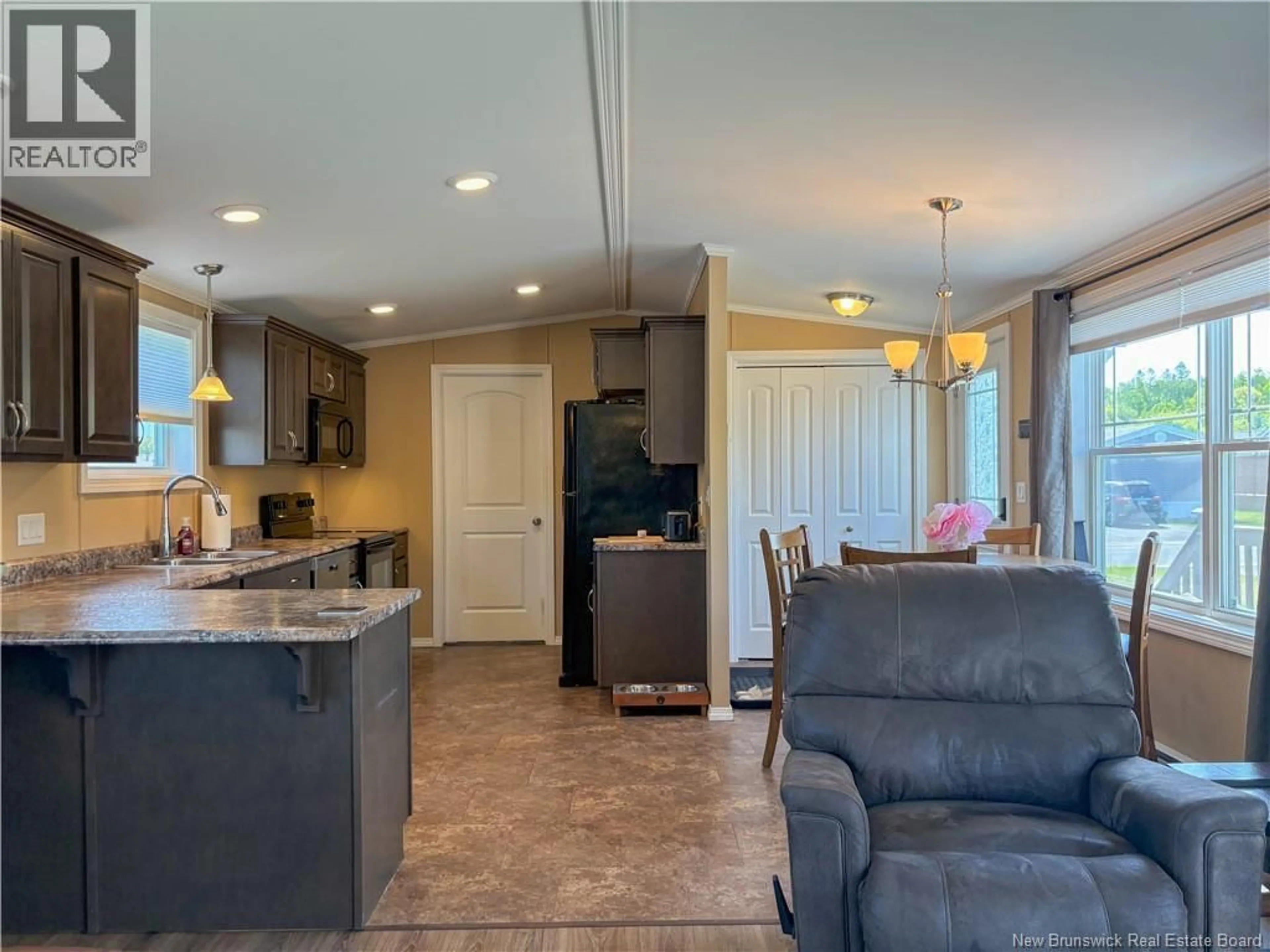 Open concept kitchen, ceramic/tile floor for 14 IVORY COURT, Woodstock New Brunswick E7M0G5