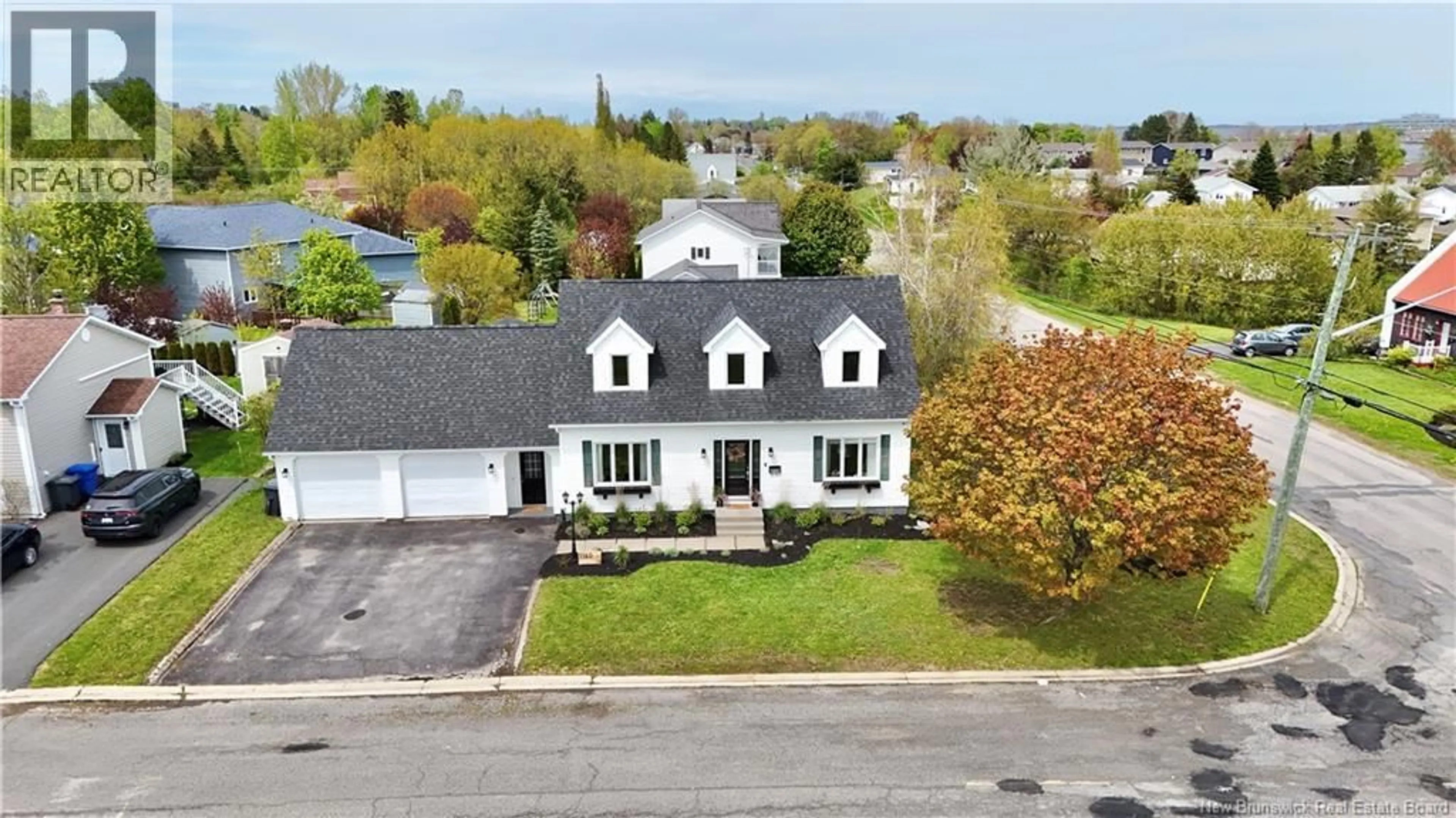 A pic from outside/outdoor area/front of a property/back of a property/a pic from drone, street for 1160 RIVERSIDE, Bathurst New Brunswick E2A4X2