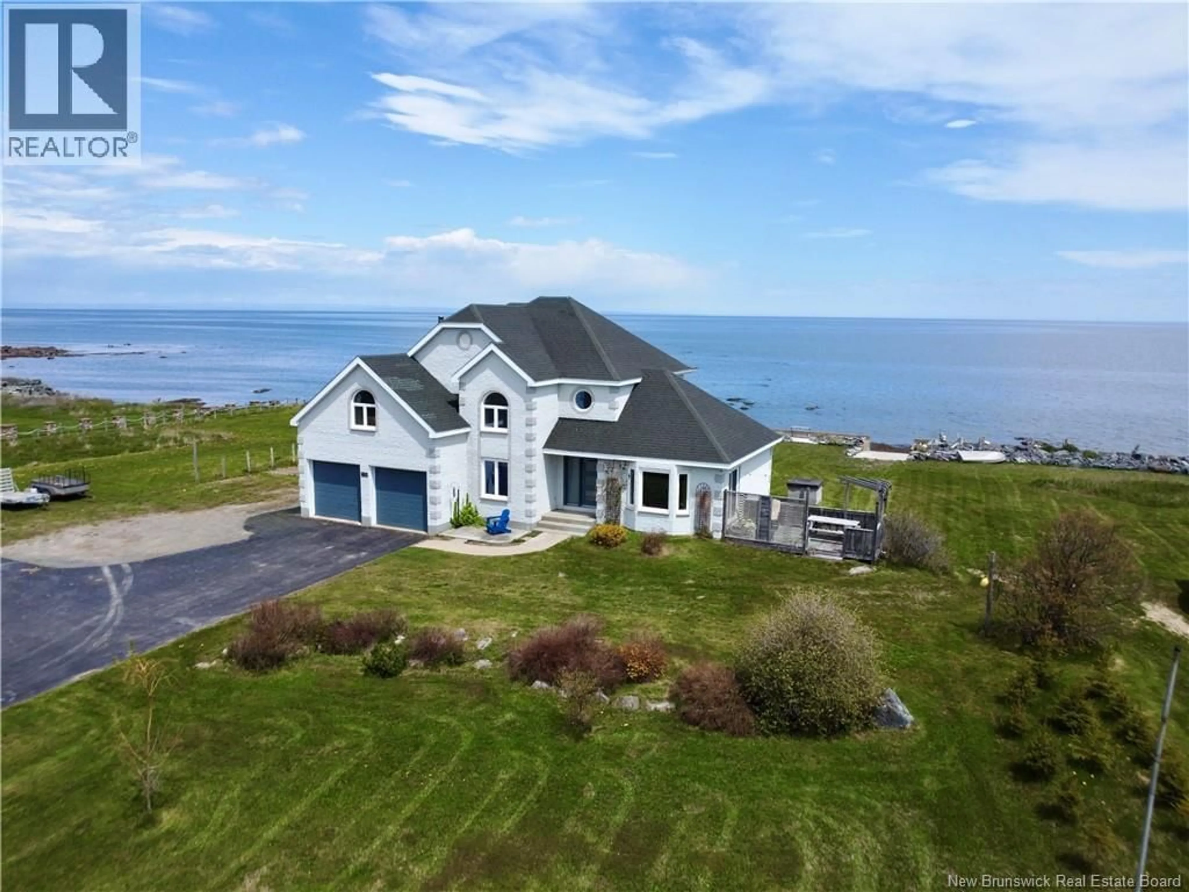 A pic from outside/outdoor area/front of a property/back of a property/a pic from drone, water/lake/river/ocean view for 411 PRINCIPALE, Petit-Rocher New Brunswick E8J1L9