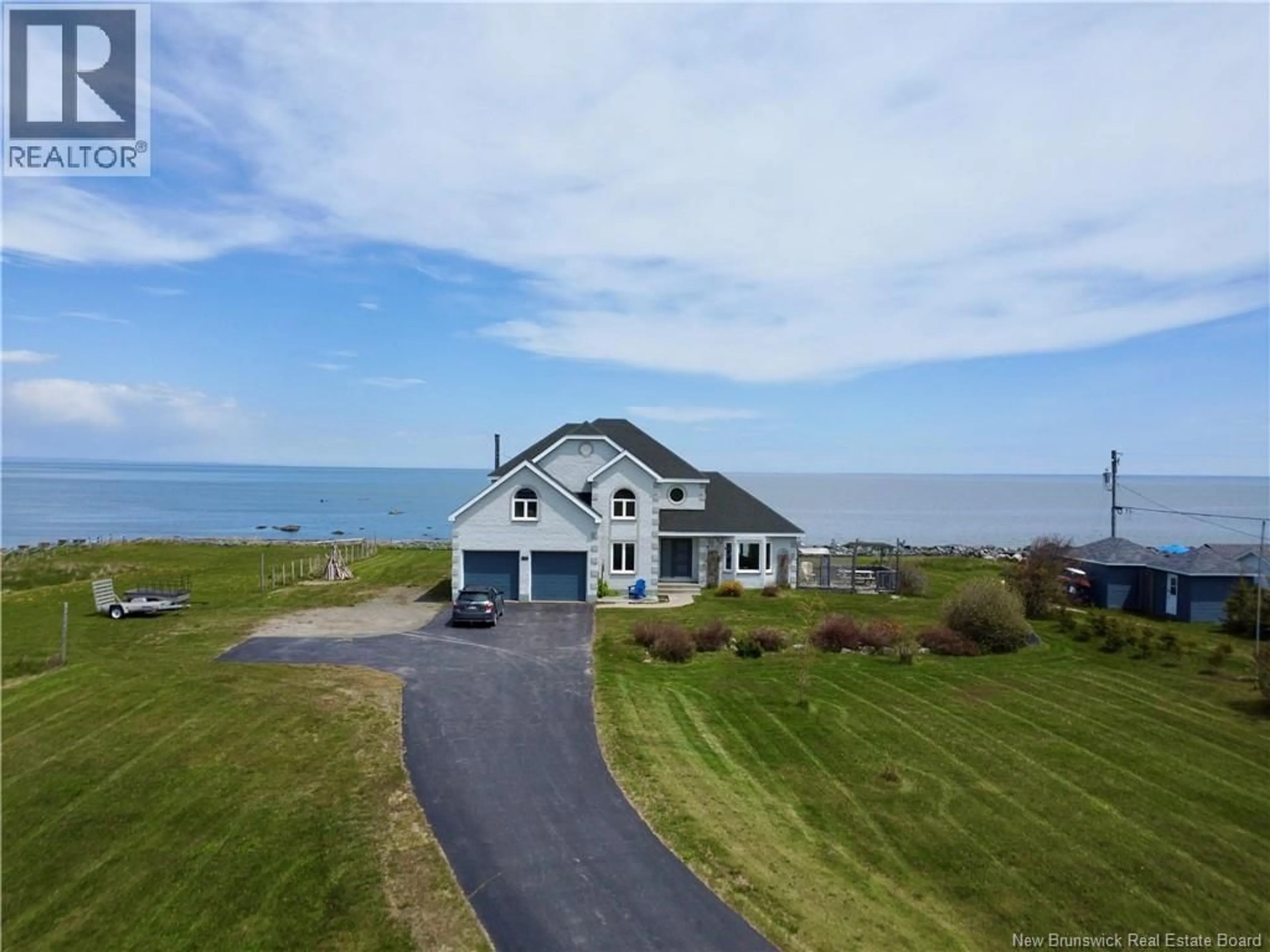 A pic from outside/outdoor area/front of a property/back of a property/a pic from drone, water/lake/river/ocean view for 411 PRINCIPALE, Petit-Rocher New Brunswick E8J1L9