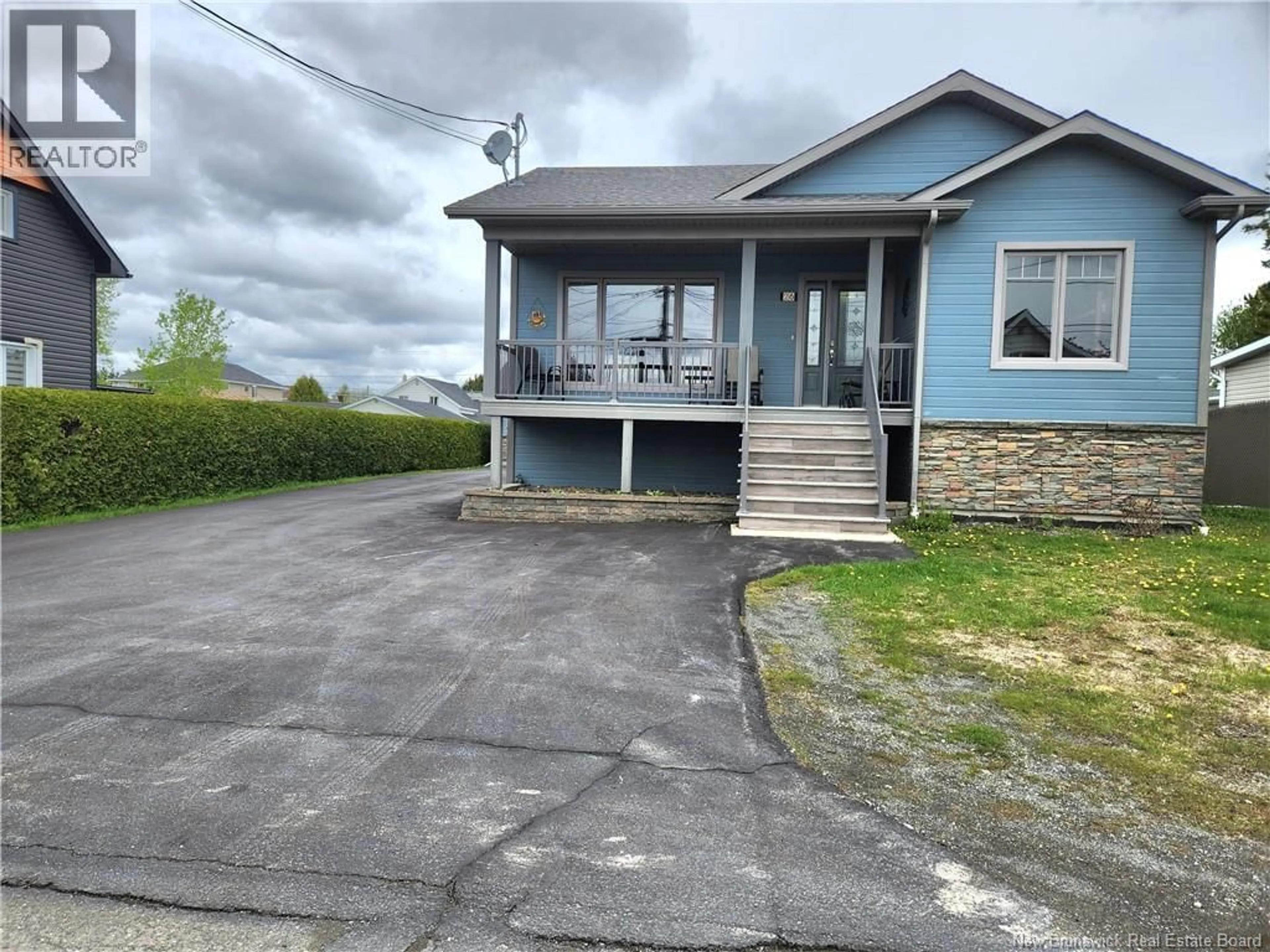 A pic from outside/outdoor area/front of a property/back of a property/a pic from drone, street for 26 RUE MGR MELANSON RUE, Saint-Quentin New Brunswick E8A1X3
