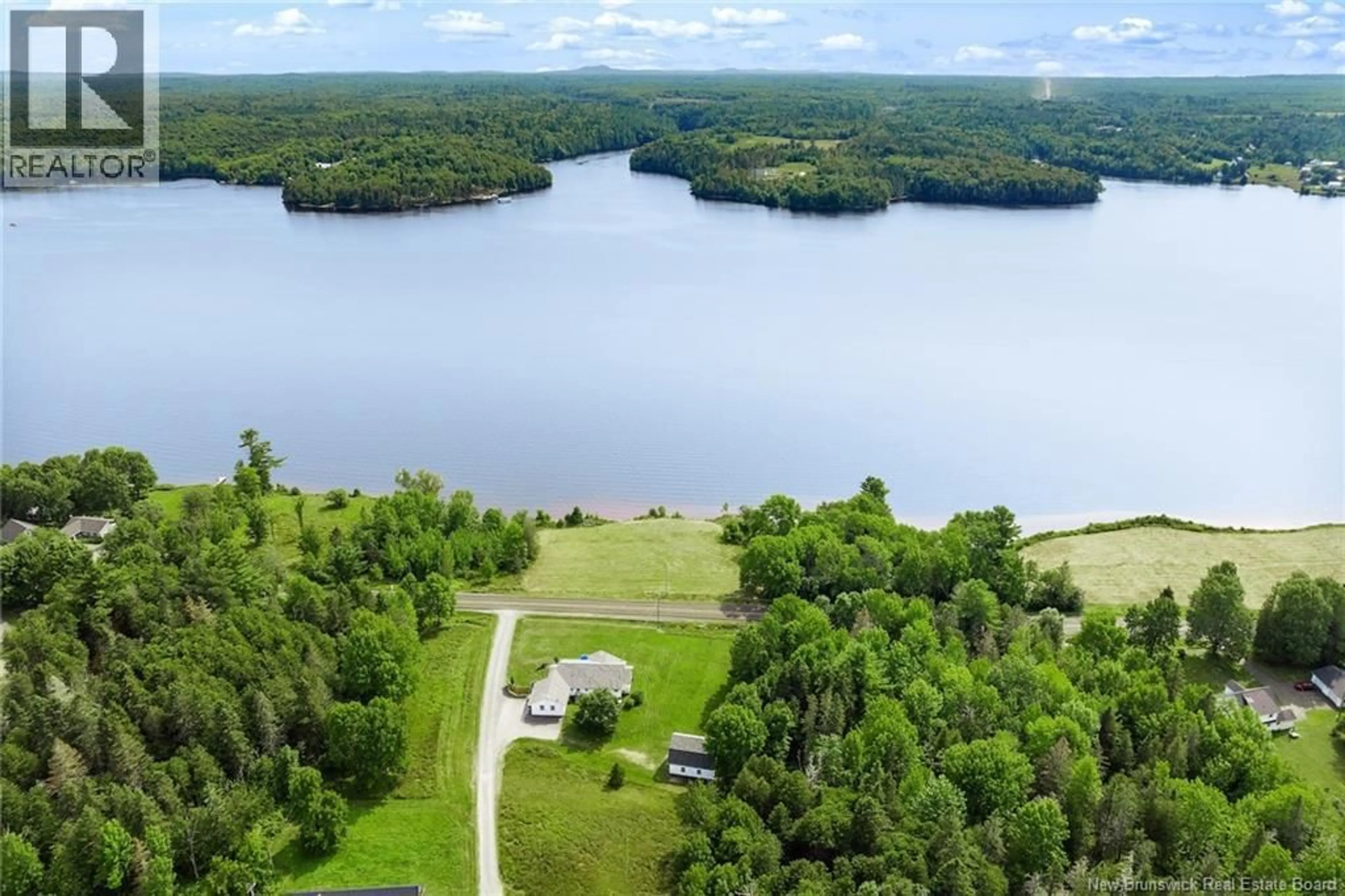 A pic from outside/outdoor area/front of a property/back of a property/a pic from drone, water/lake/river/ocean view for 2446 ROUTE 105, Lower Queensbury New Brunswick E6L1G2