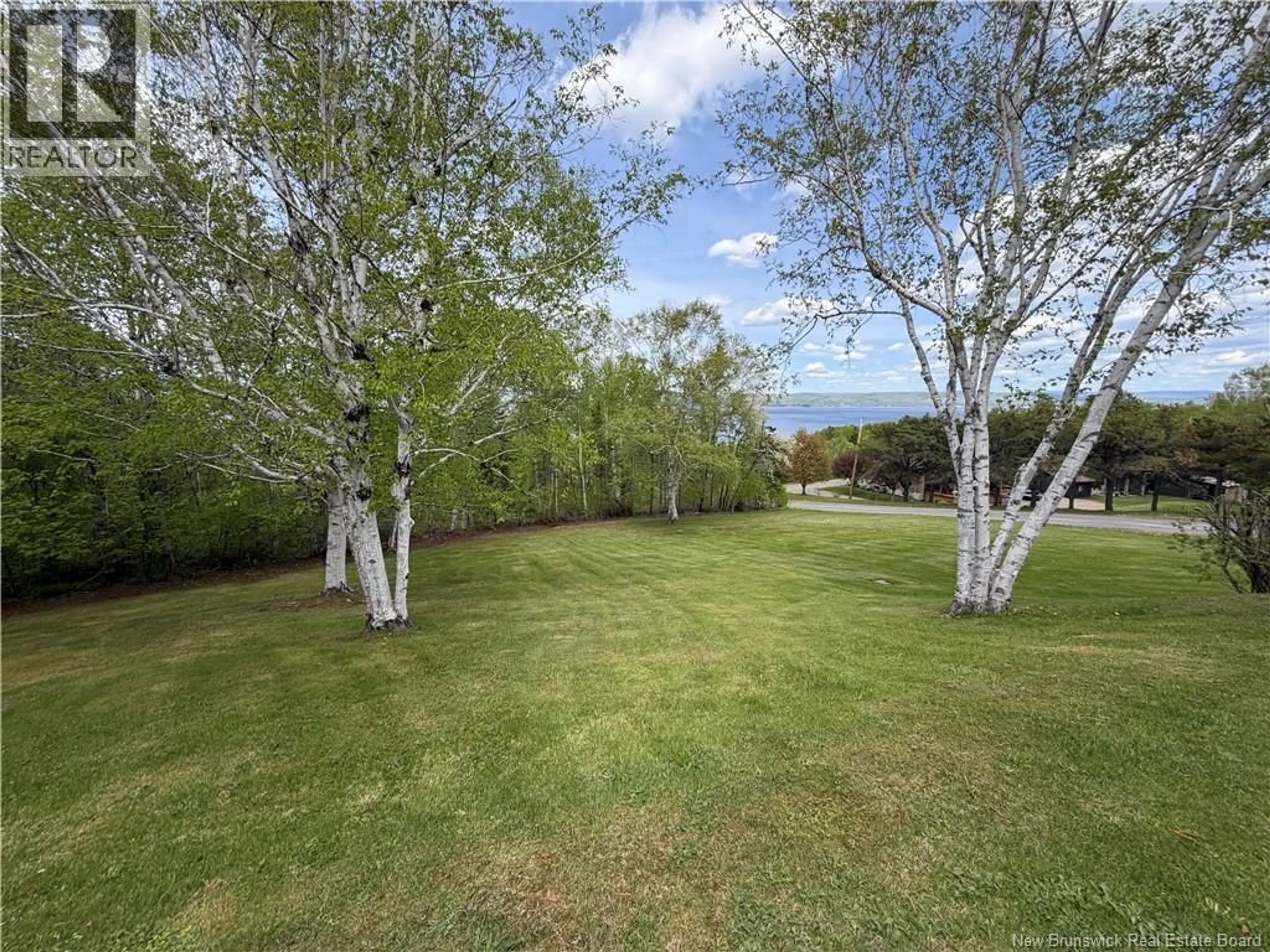 A pic from outside/outdoor area/front of a property/back of a property/a pic from drone, forest/trees view for 25 MCNEISH ROAD, Point La Nim New Brunswick E3N6B8