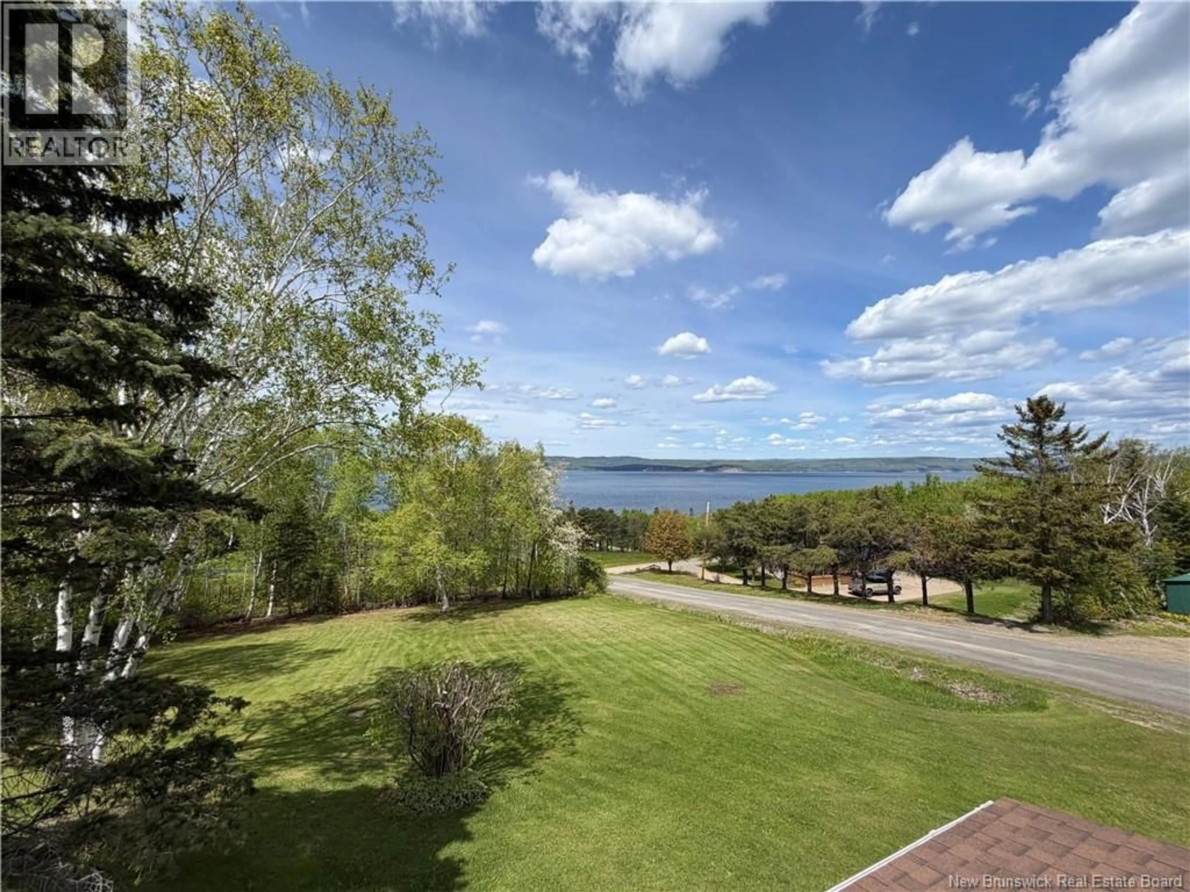 A pic from outside/outdoor area/front of a property/back of a property/a pic from drone, water/lake/river/ocean view for 25 MCNEISH ROAD, Point La Nim New Brunswick E3N6B8