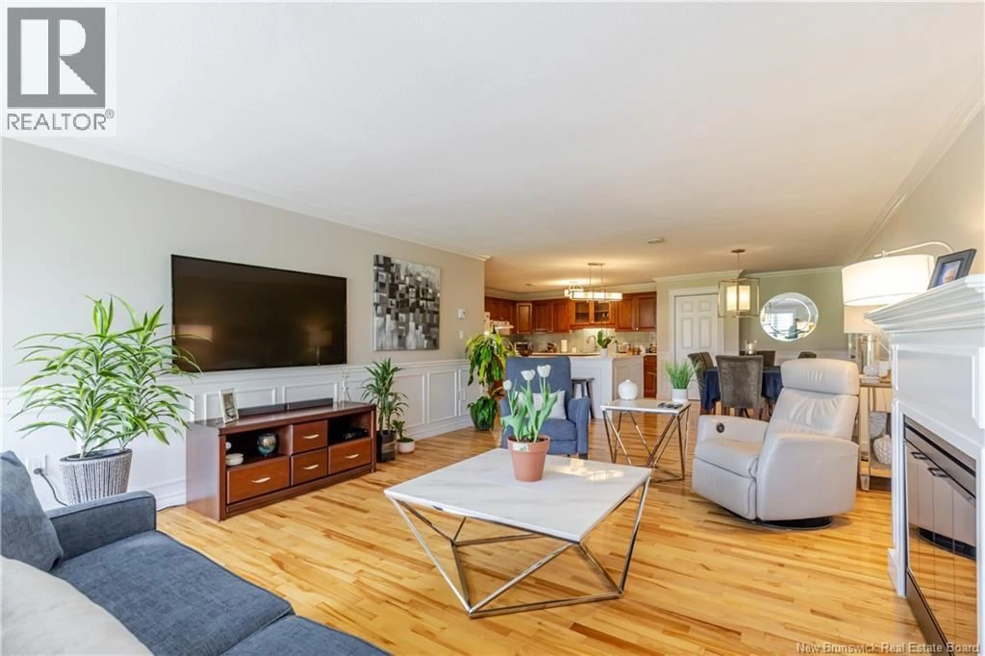 Living room with furniture, wood/laminate floor for 13 - 185 REYNOLDS STREET, Fredericton New Brunswick E3A0K7