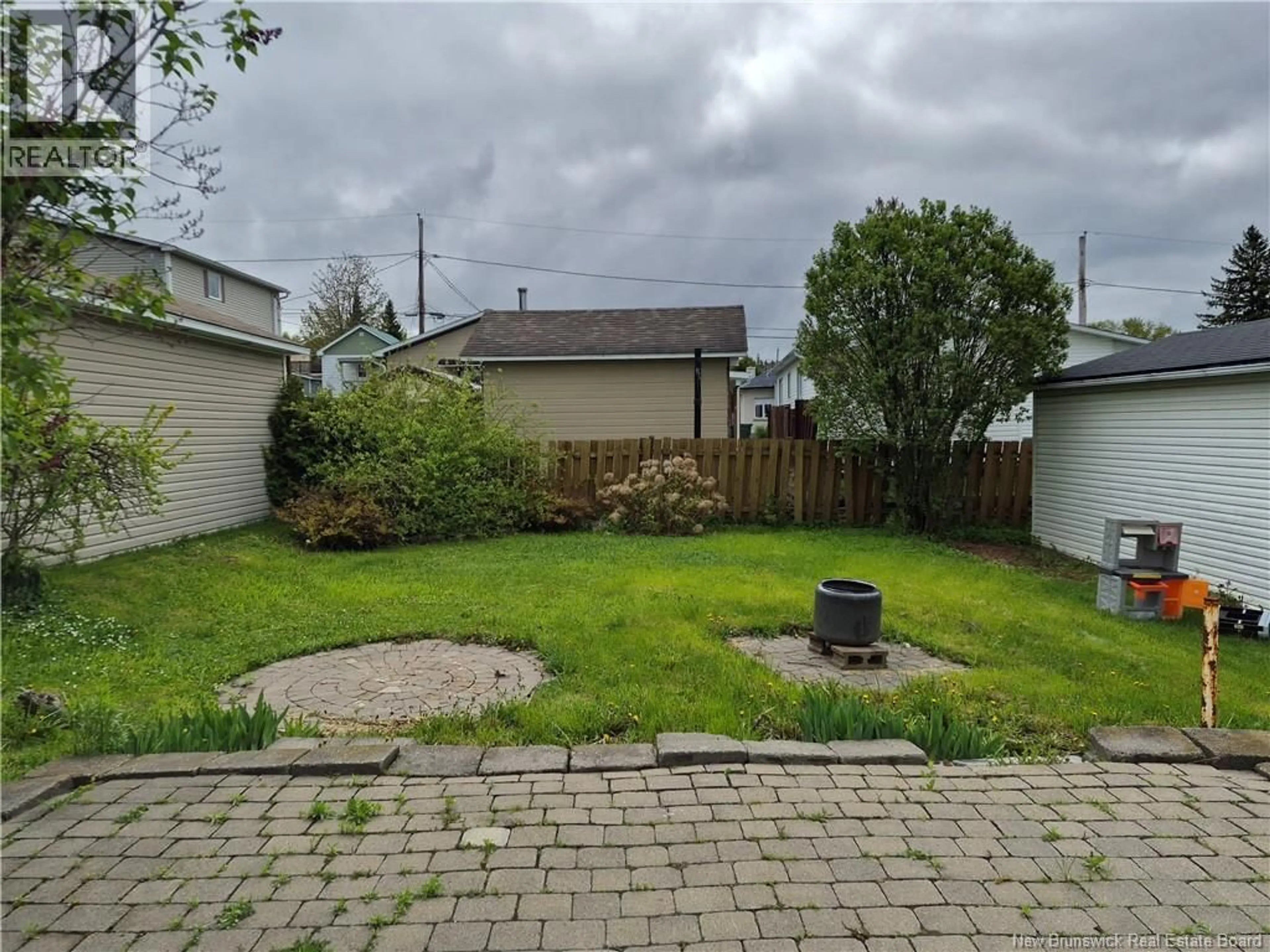 A pic from outside/outdoor area/front of a property/back of a property/a pic from drone, street for 115 46TH AVE, Edmundston New Brunswick E3V3B7