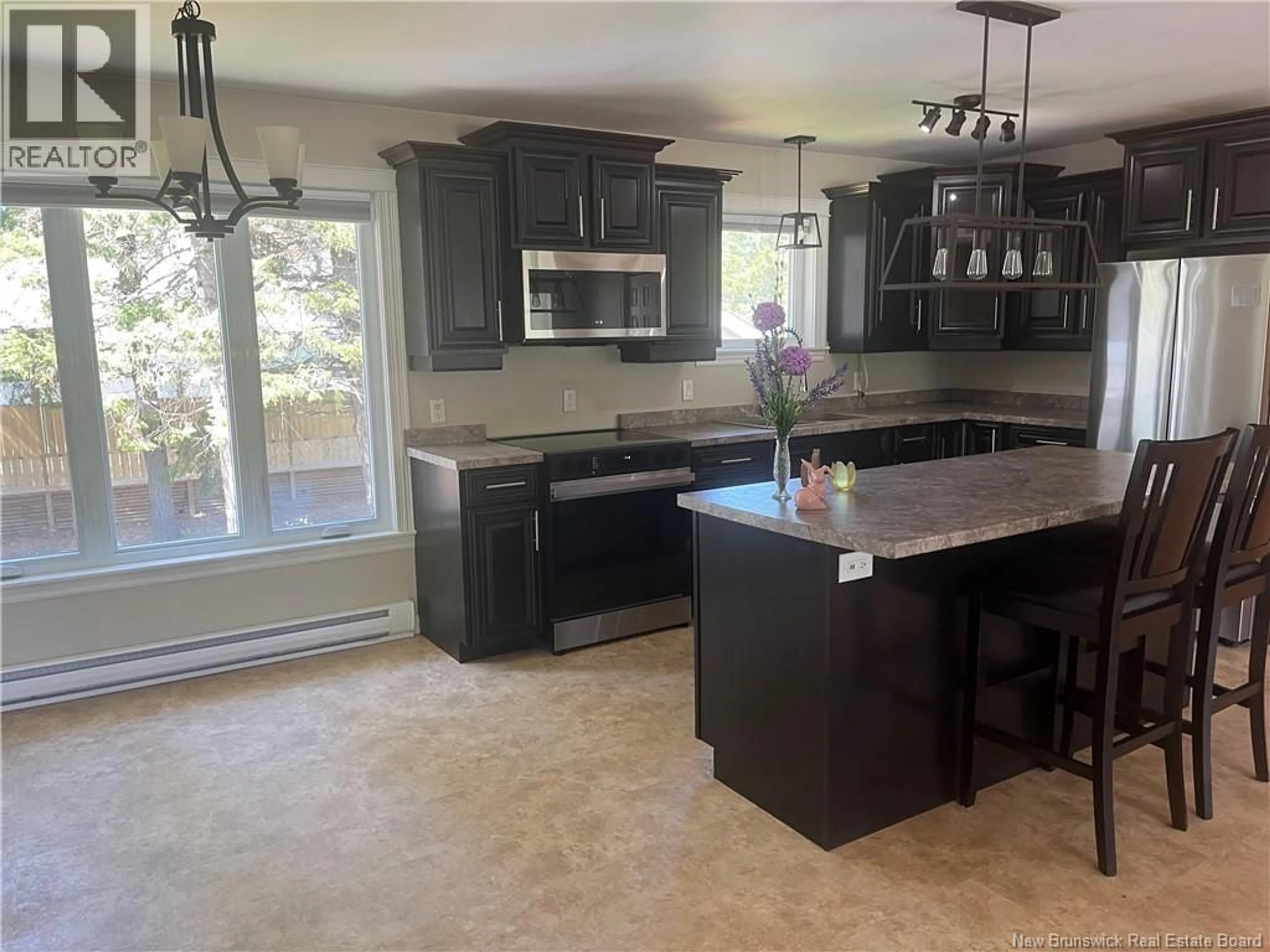 Open concept kitchen, ceramic/tile floor for 71 COLIN DRIVE, Miramichi New Brunswick E1V6B9