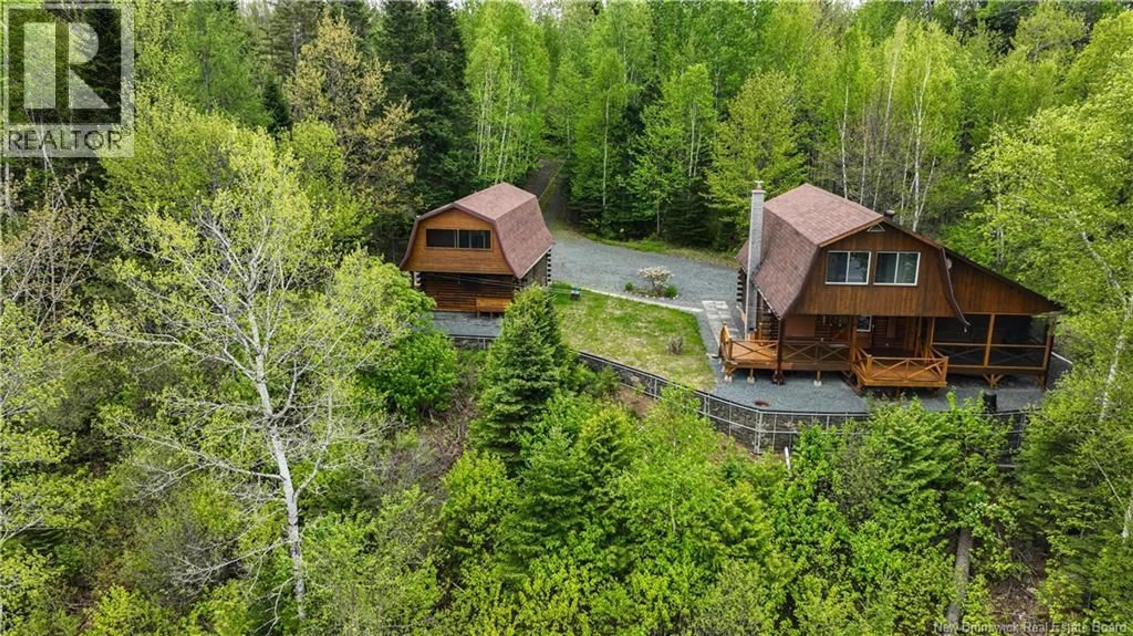 A pic from outside/outdoor area/front of a property/back of a property/a pic from drone, forest/trees view for 2337 RTE 118, McKinleyville New Brunswick E9E2H5