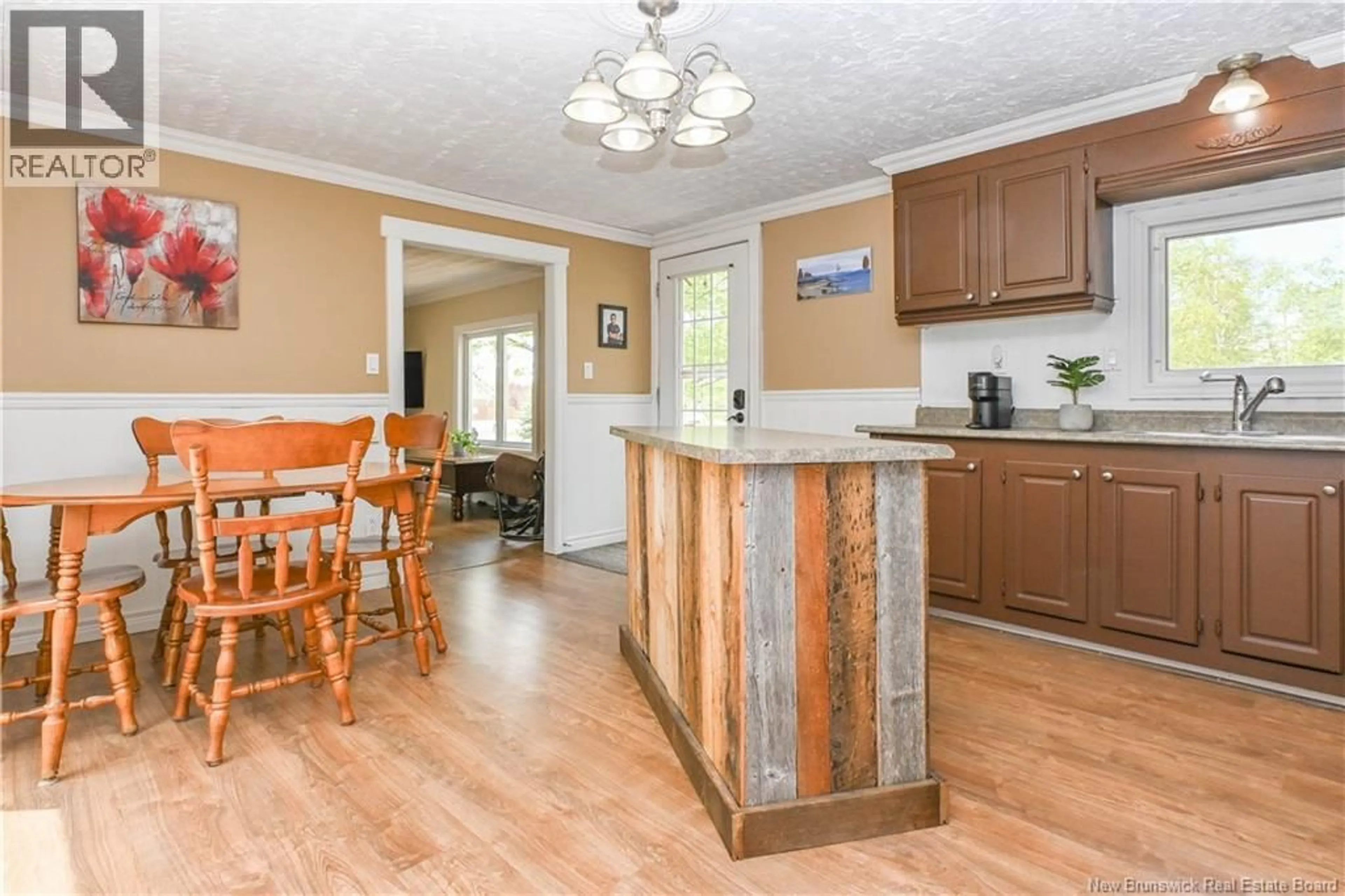 Open concept kitchen, wood/laminate floor for 258 DU BOCAGE STREET, Saint-Léolin New Brunswick E8N2S8