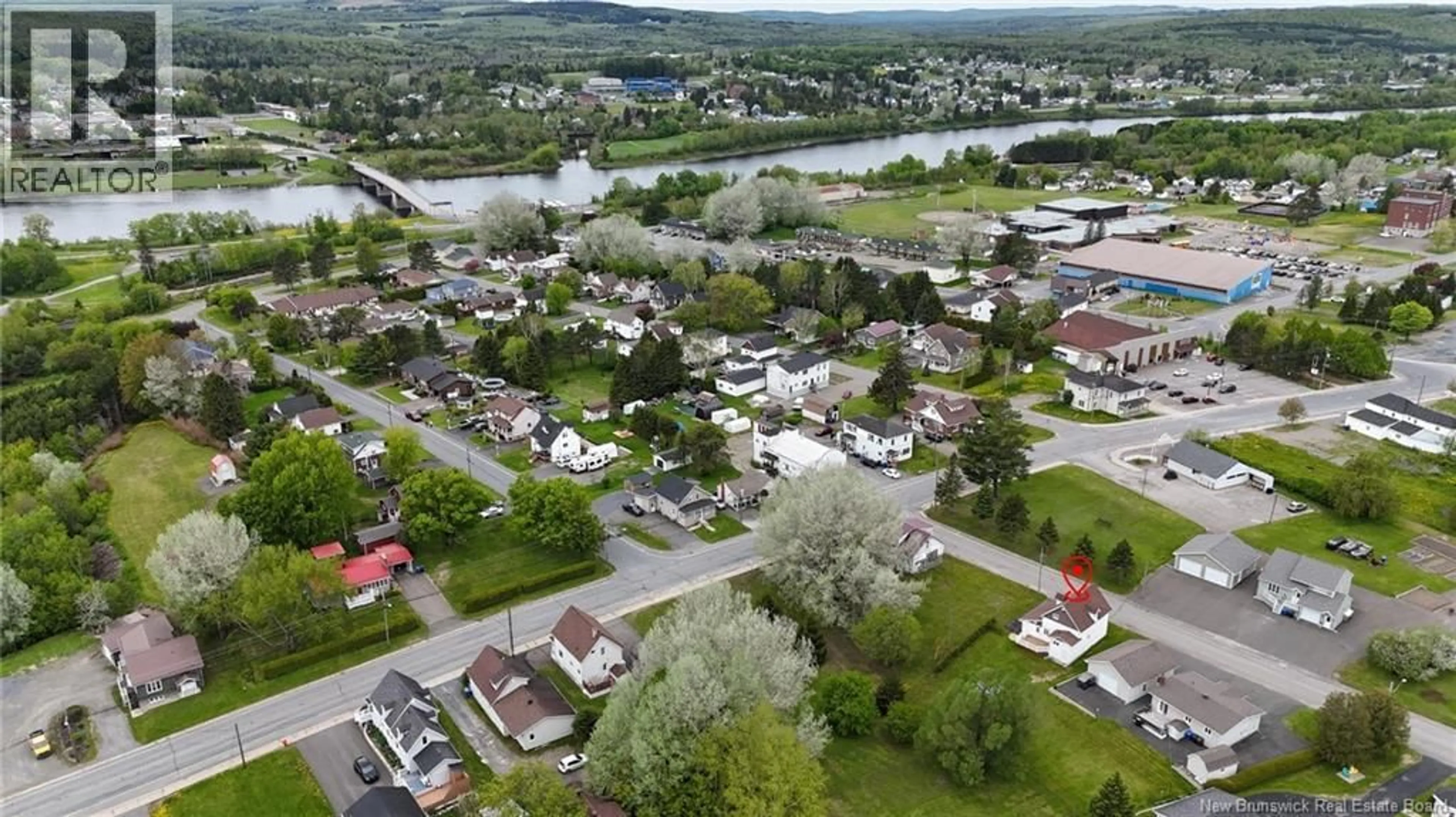 A pic from outside/outdoor area/front of a property/back of a property/a pic from drone, water/lake/river/ocean view for 13 VIOLETTE, Saint-Léonard New Brunswick E7E1Z8