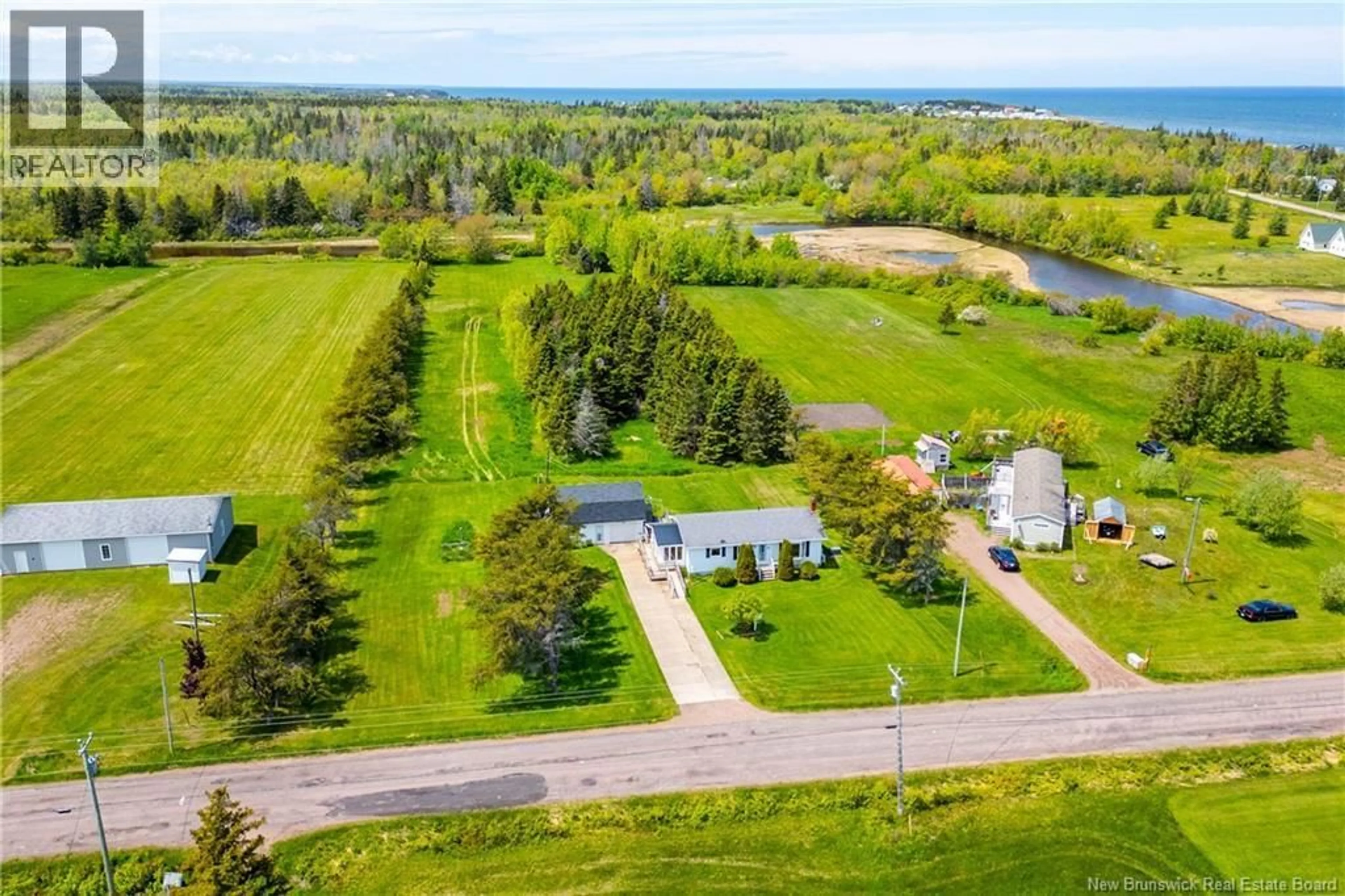 A pic from outside/outdoor area/front of a property/back of a property/a pic from drone, water/lake/river/ocean view for 23 MURRAY ROAD, Little Shemogue New Brunswick E4M3N8