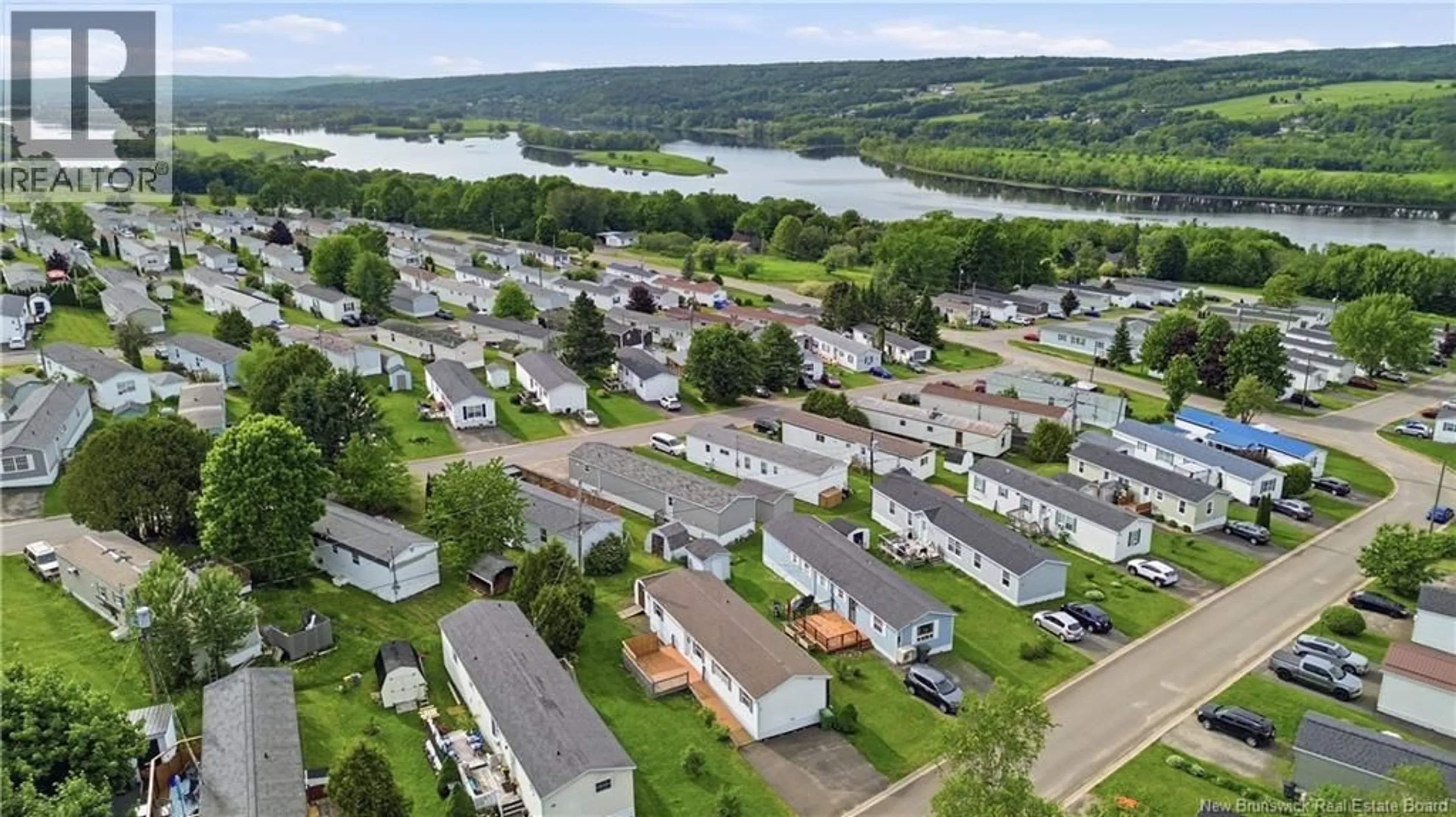 A pic from outside/outdoor area/front of a property/back of a property/a pic from drone, water/lake/river/ocean view for 21 MACINTOSH STREET, Fredericton New Brunswick E3C1L8