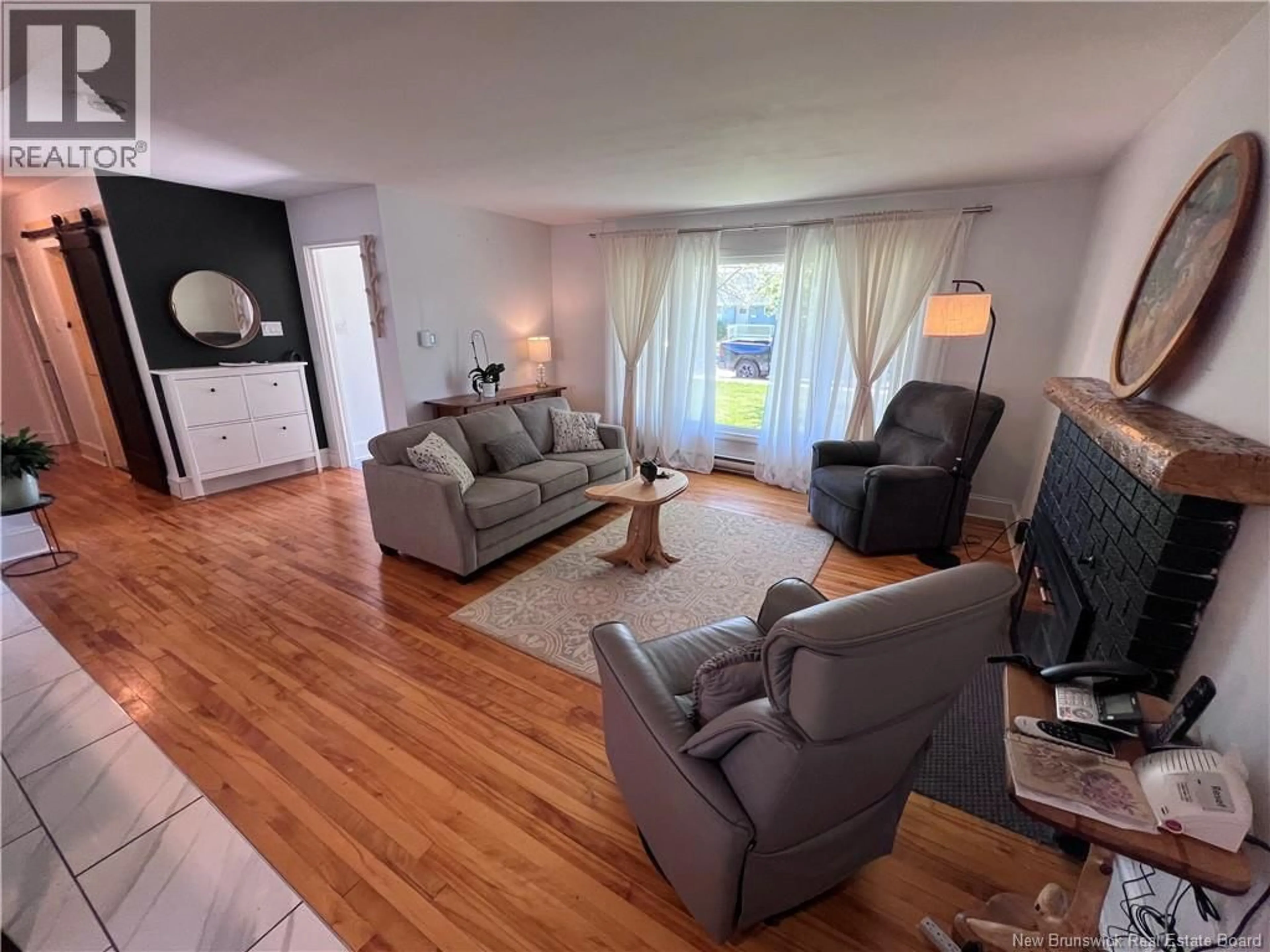 Living room with furniture, wood/laminate floor for 70 ALWARD STREET, Saint John New Brunswick E2K2K2