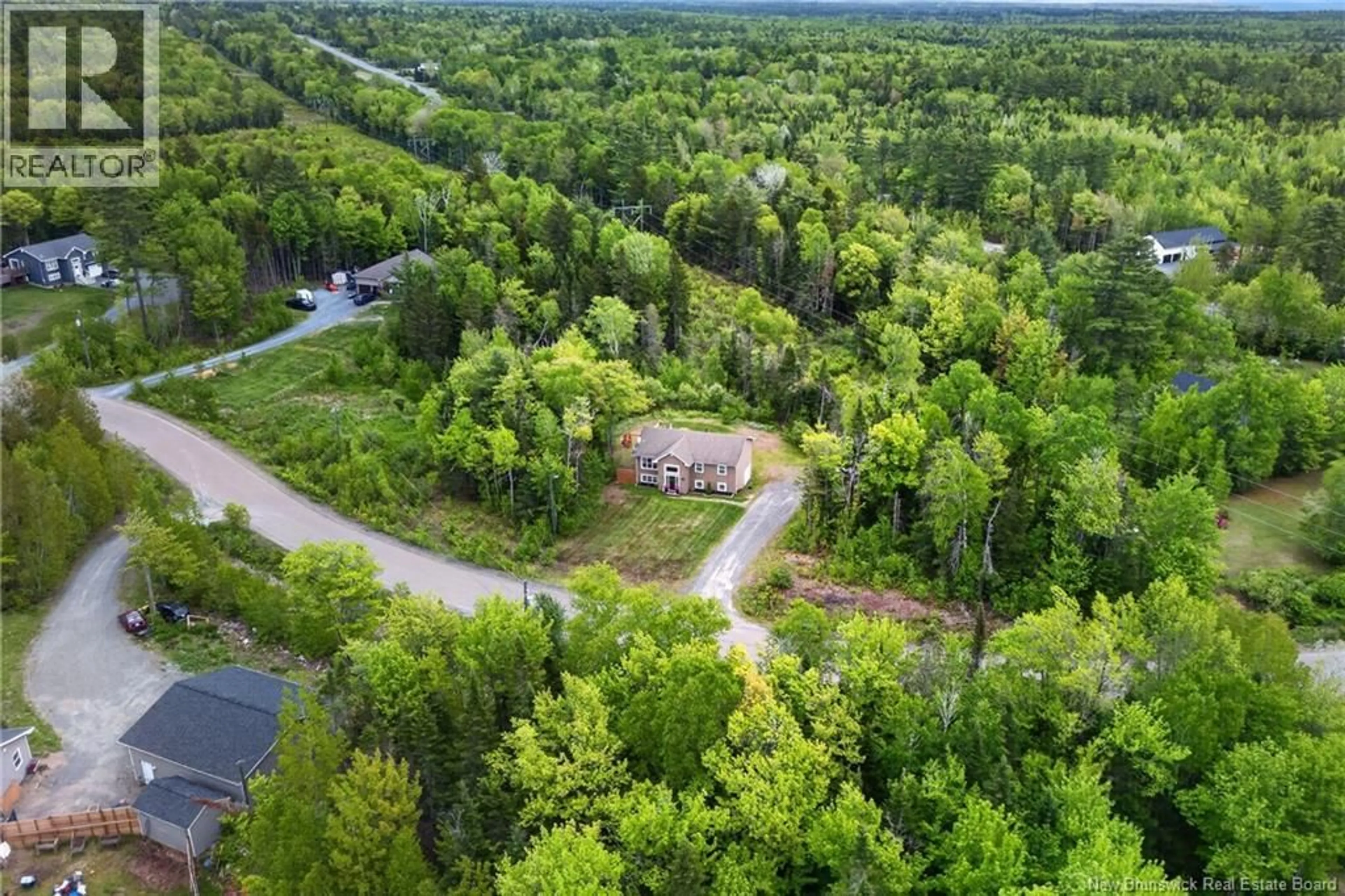 A pic from outside/outdoor area/front of a property/back of a property/a pic from drone, forest/trees view for 14 CHARDONNAY STREET, Fredericton New Brunswick E3A0A7