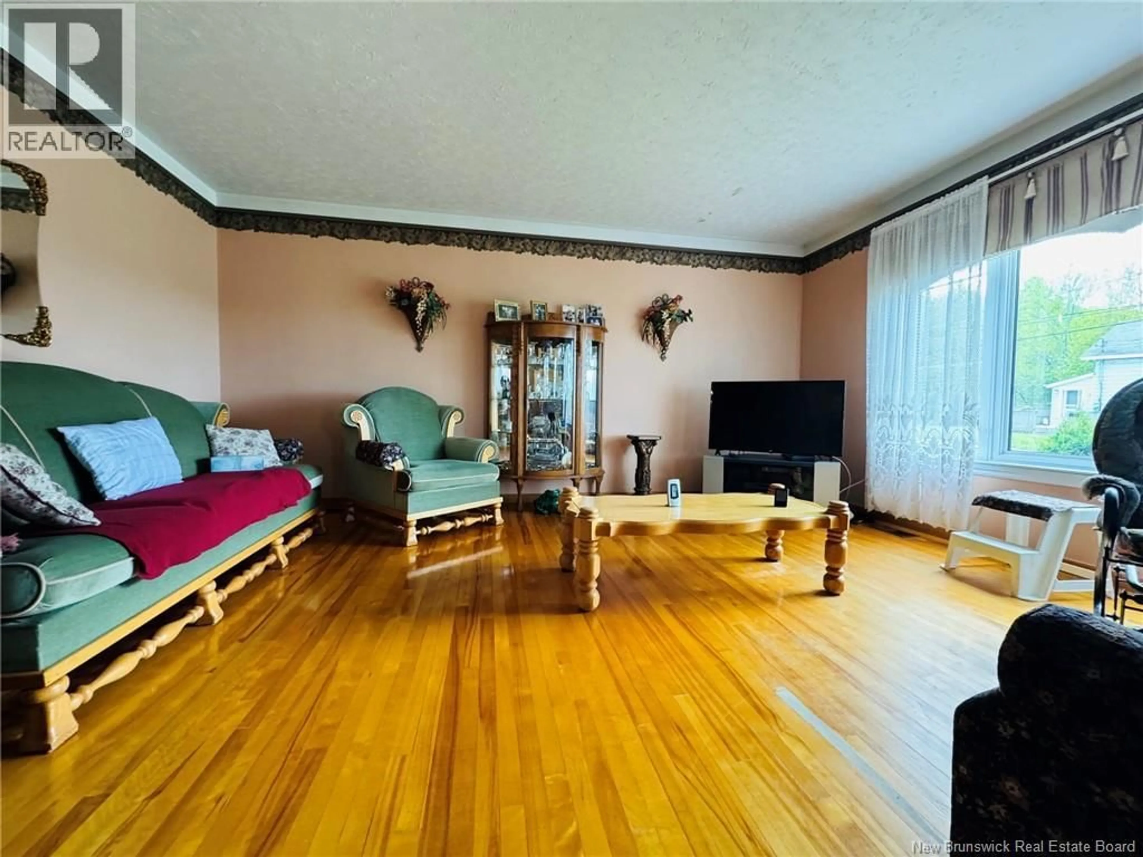 Living room with furniture, wood/laminate floor for 6 THOMPSON ROAD, Campbellton New Brunswick E3N1W1