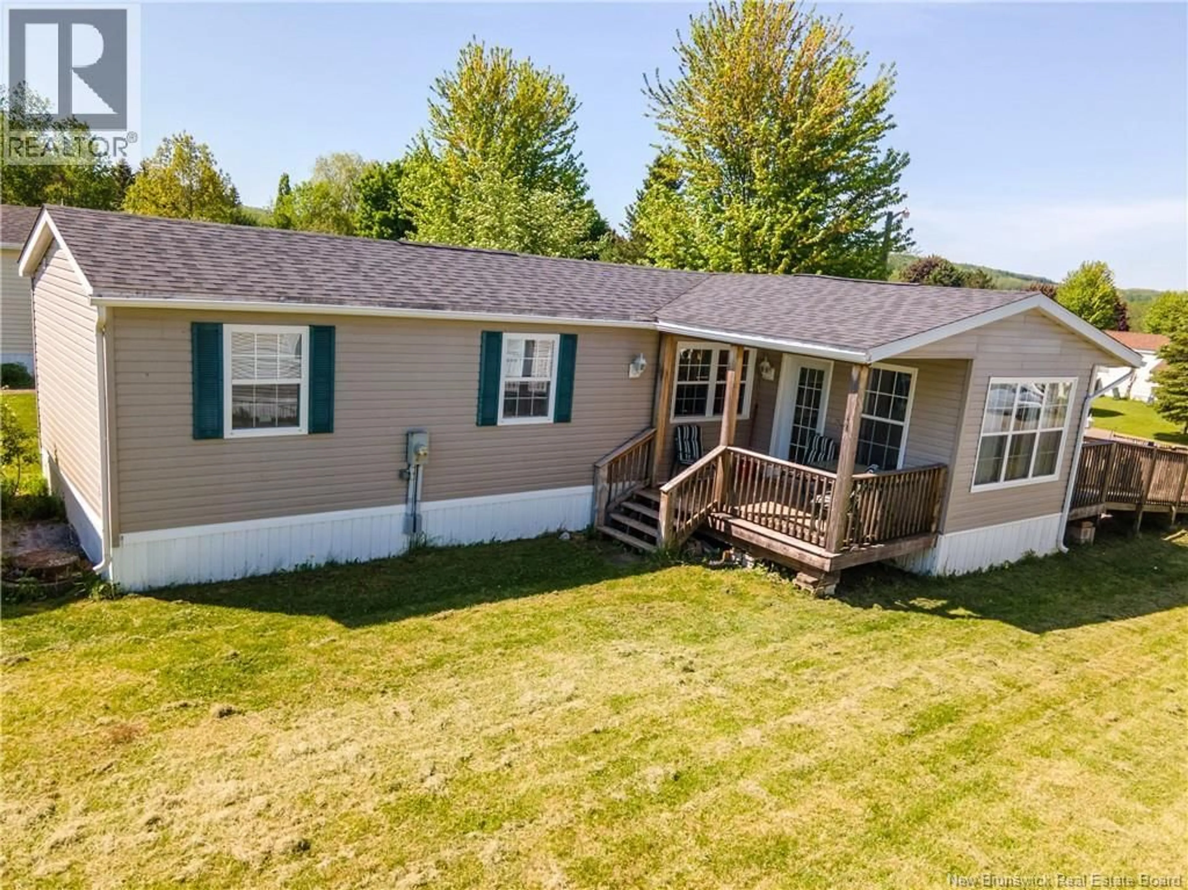 A pic from outside/outdoor area/front of a property/back of a property/a pic from drone, unknown for 98 FOURTH STREET, Sussex Corner New Brunswick E4E5V9