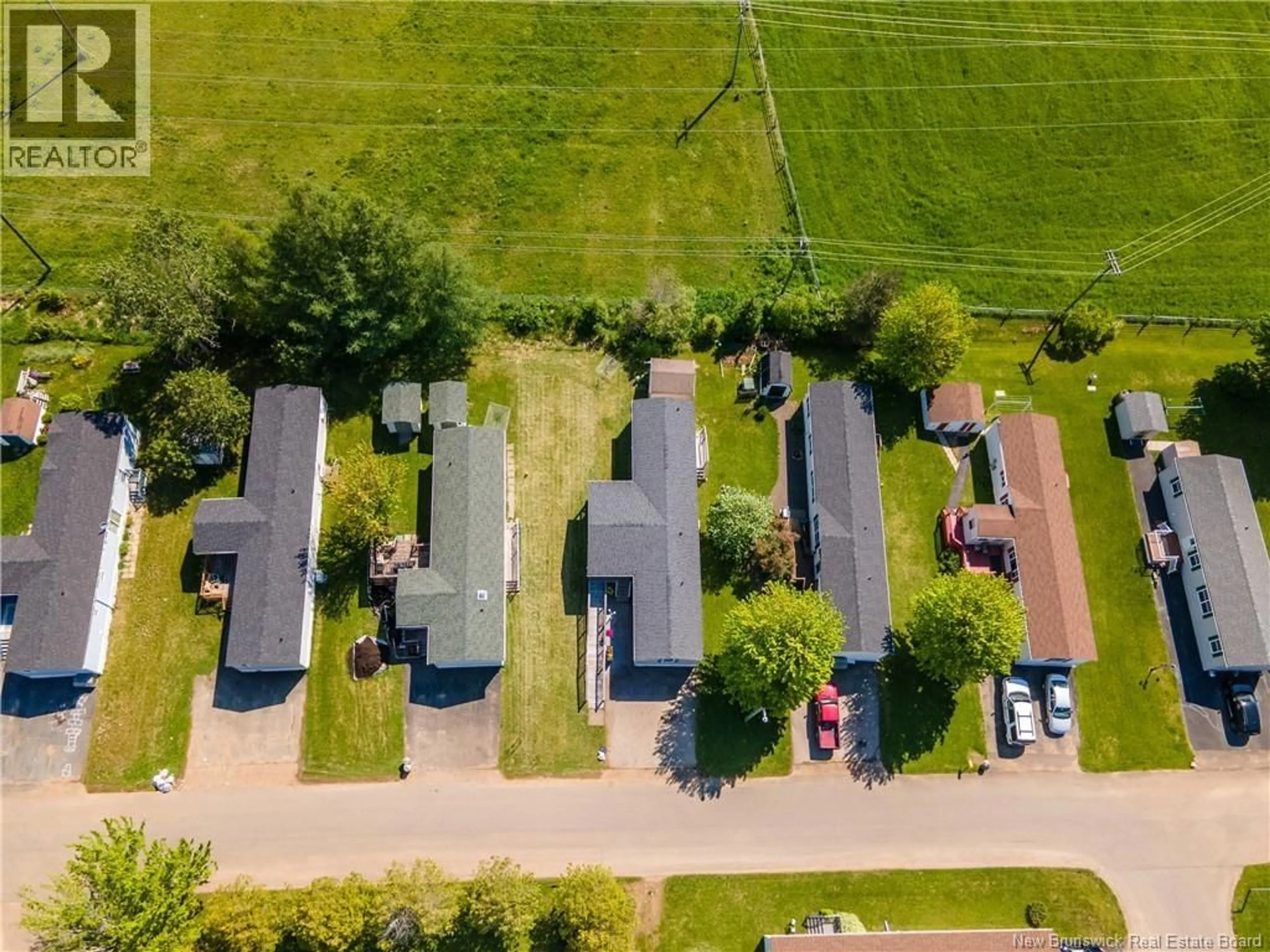 A pic from outside/outdoor area/front of a property/back of a property/a pic from drone, street for 98 FOURTH STREET, Sussex Corner New Brunswick E4E5V9