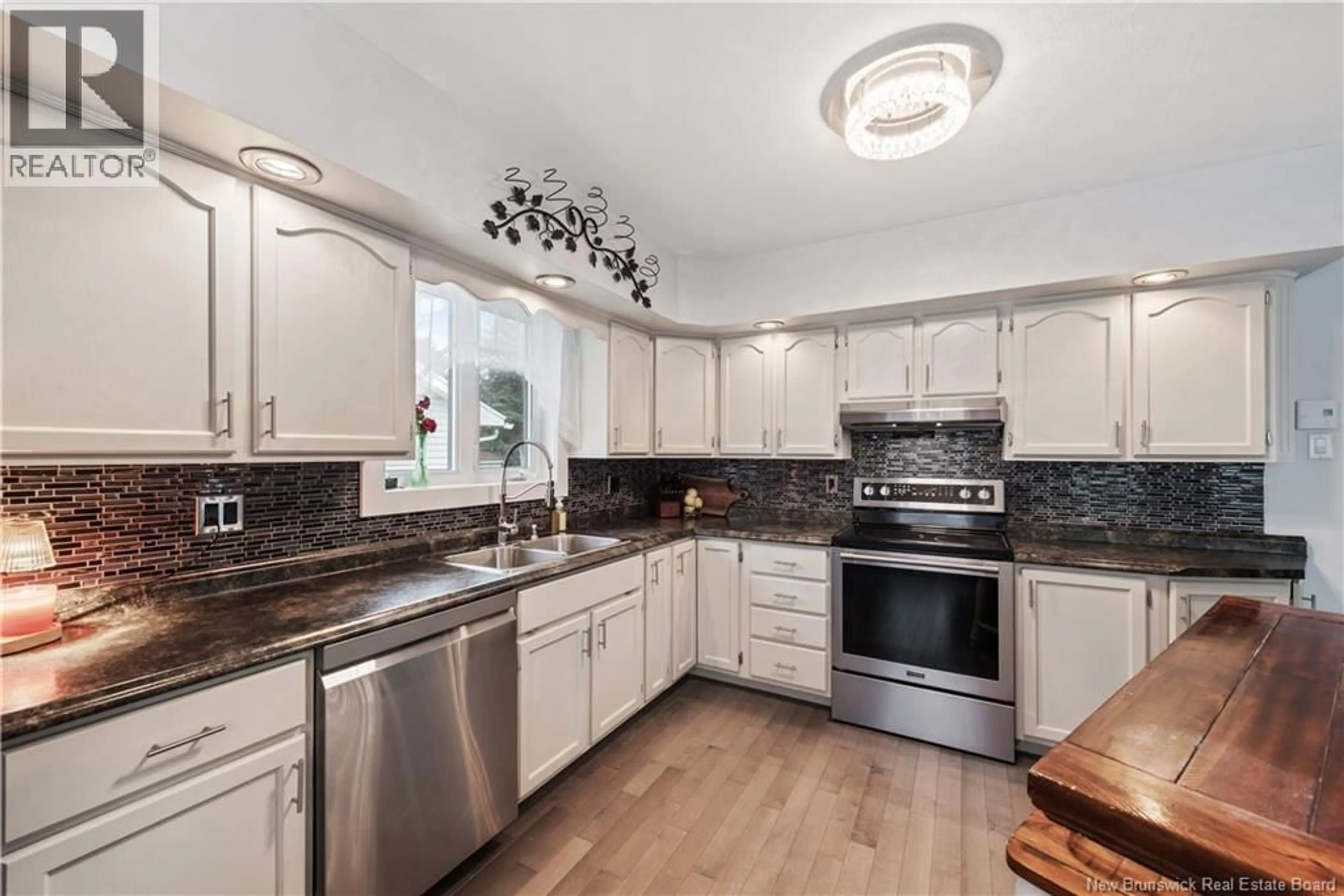 Open concept kitchen, ceramic/tile floor for 321 GOULD STREET, Dieppe New Brunswick E1A1V2
