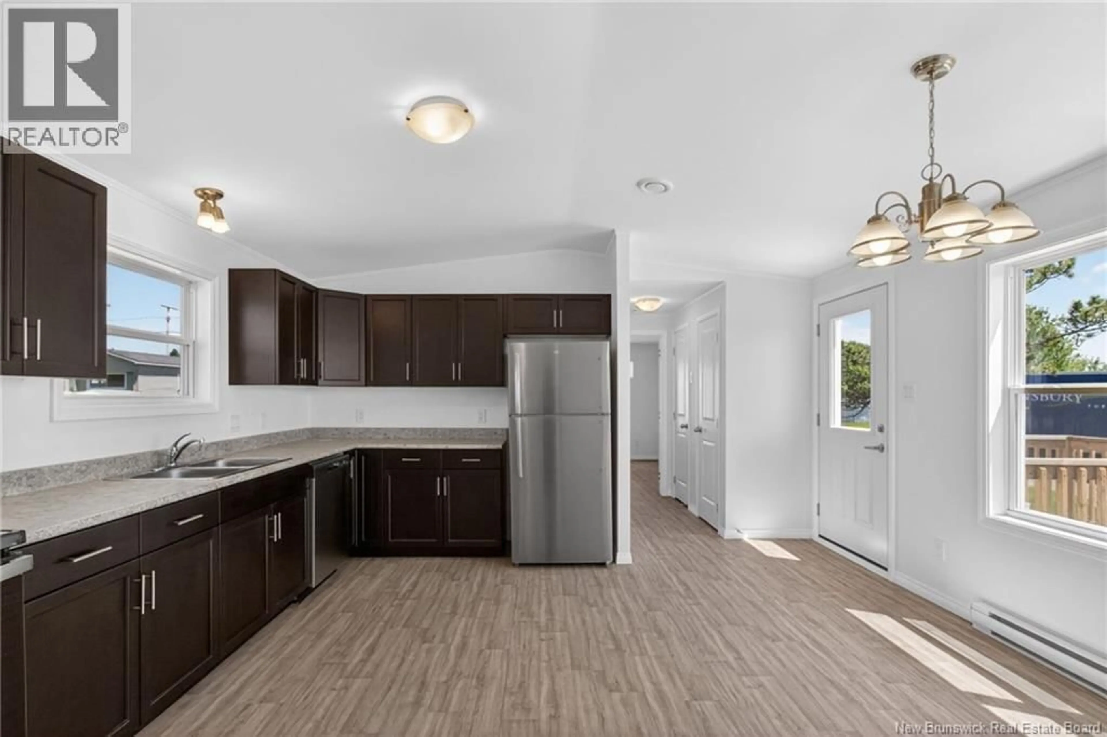 Open concept kitchen, wood/laminate floor for 8 LINDA LANE, Moncton New Brunswick E1E3T8