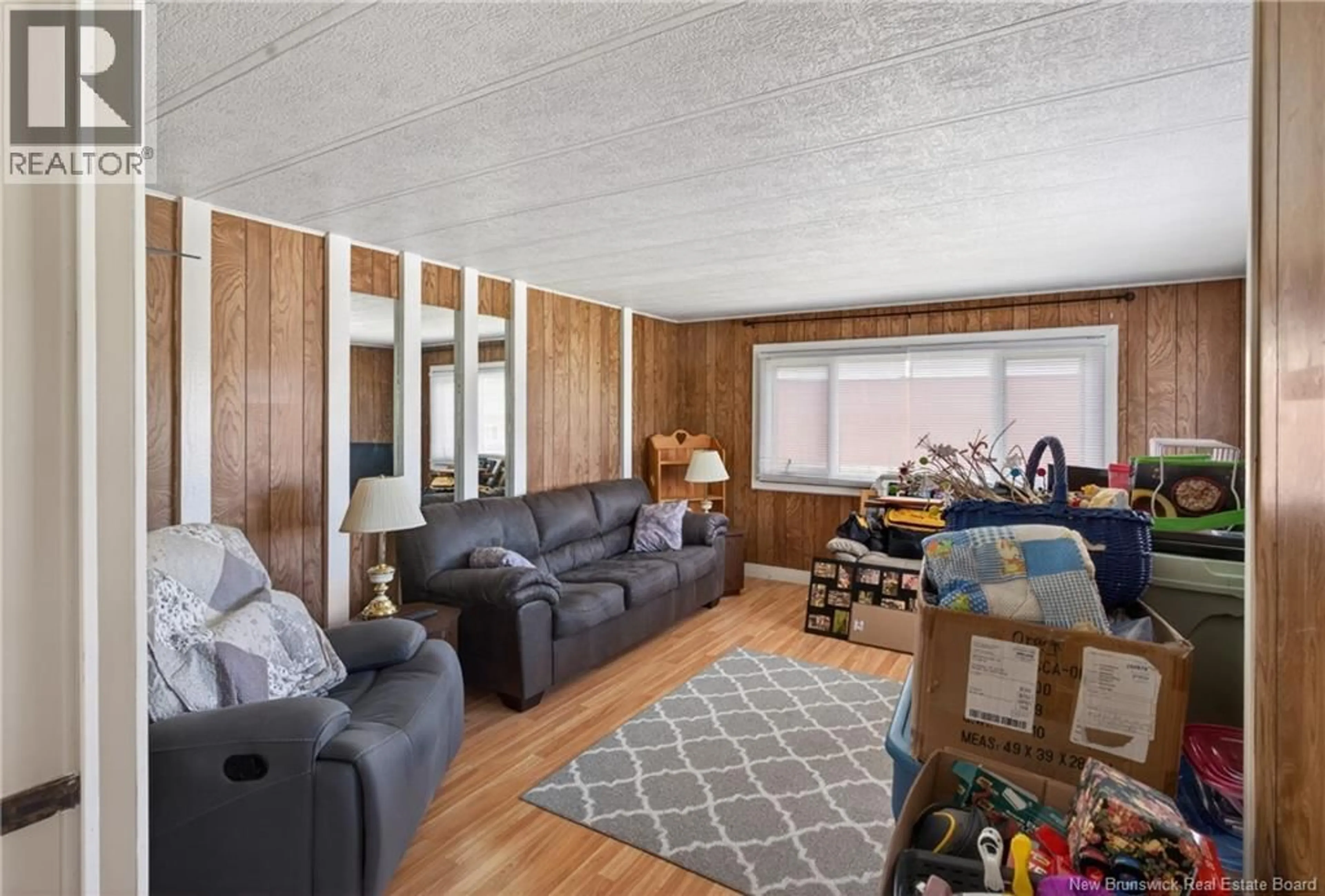 Living room with furniture, wood/laminate floor for 30467 ROUTE 134, Mcleods New Brunswick E3N5V2